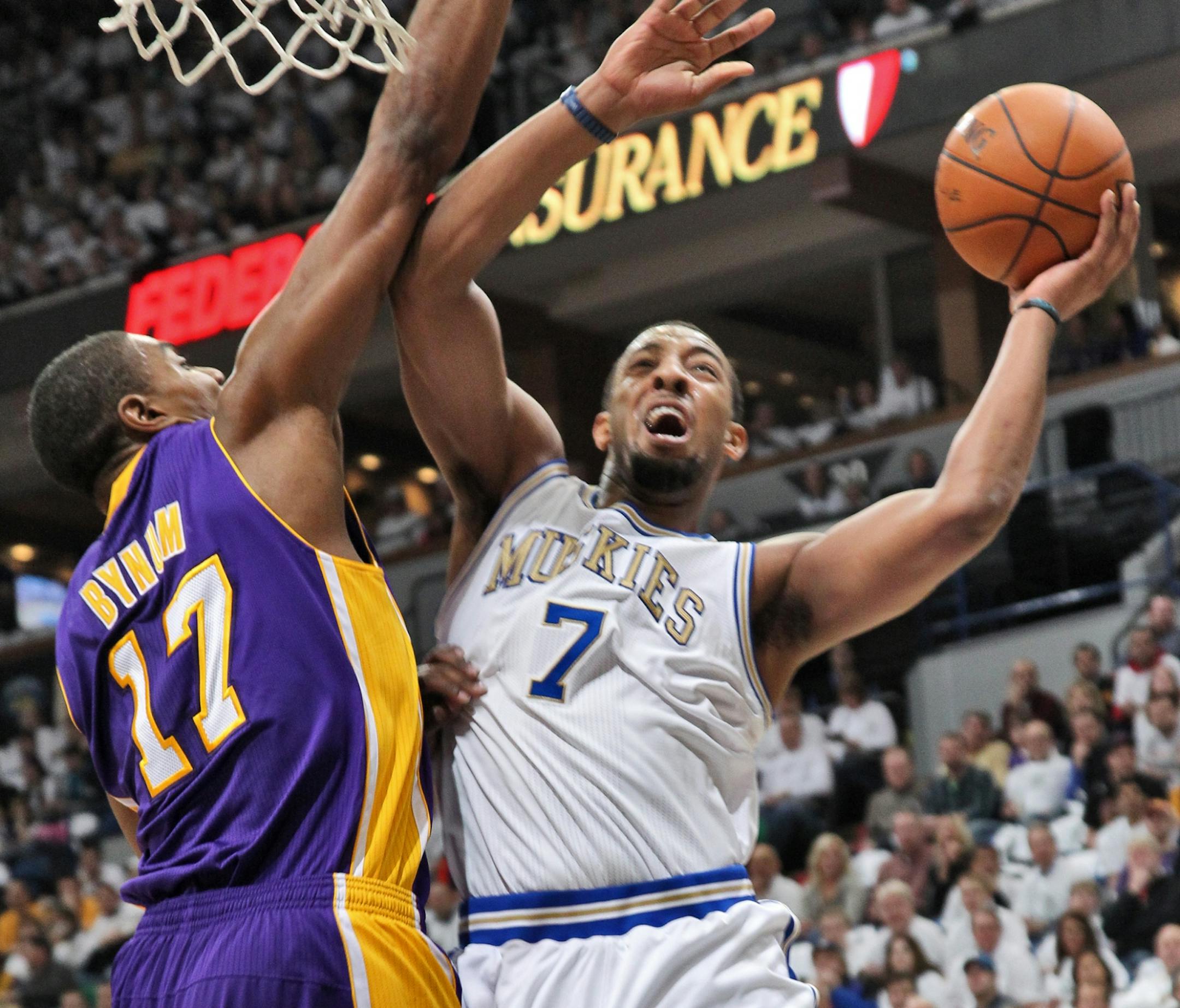 Timberwolves vs. LA Lakers. Lakers won 105-102. Wolves Derrick Williams (7) headed to the basket around the defense of Lakers Andrew Bynum.