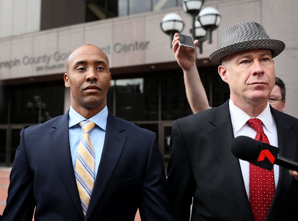 Former Minneapolis police officer Mohamed Noor, left, appeared in Hennepin County District Court with his attorney, Thomas Plunkett.