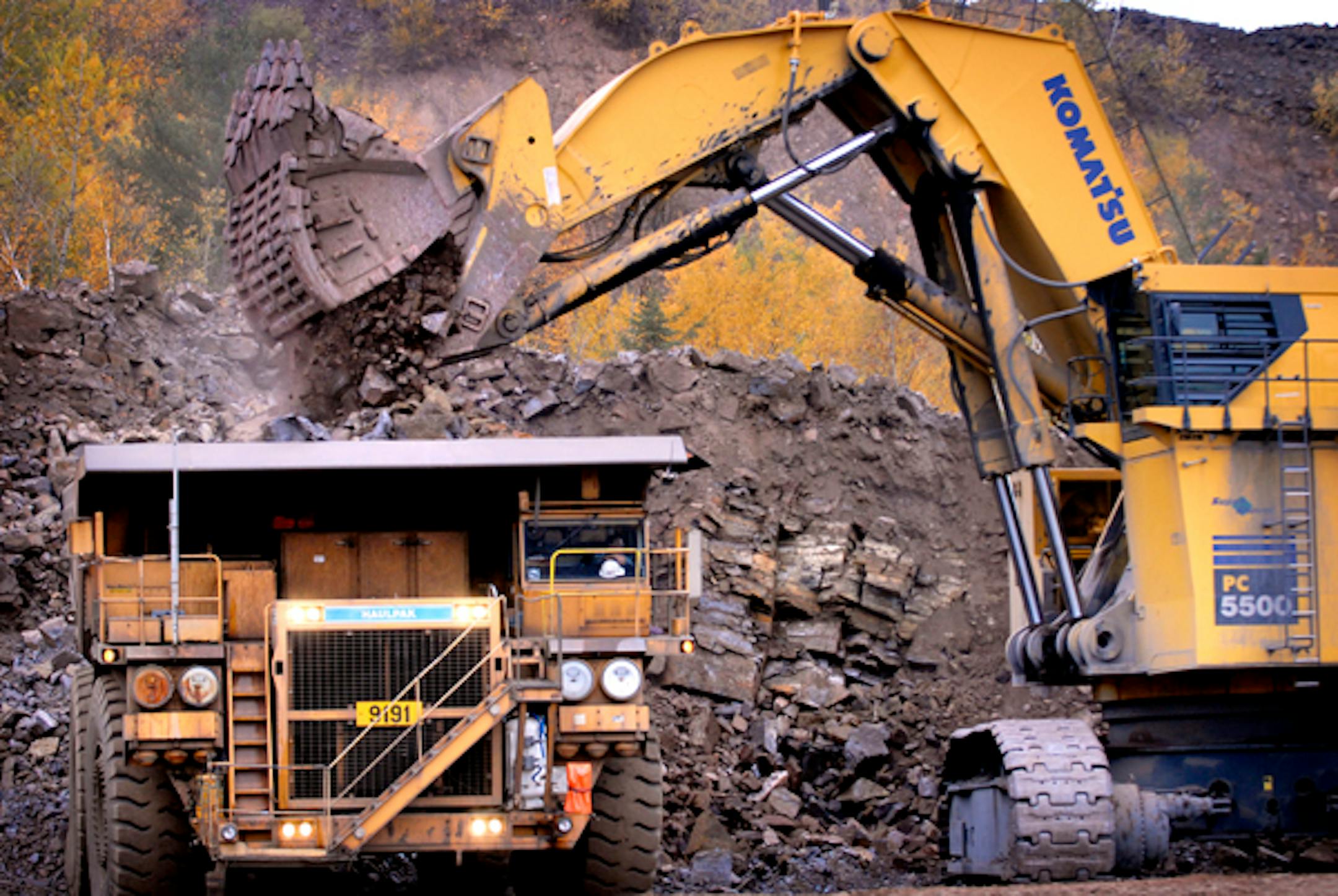 A gigantic earth-moving machine shoveled taconite ore chunks — as much as 50 tons at a time — into a 240-ton dump truck at United Taconite in Eveleth, Minn., in 2006.