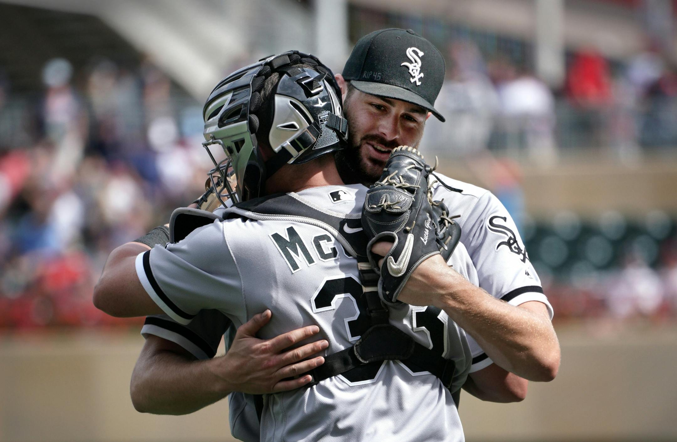 Chicago White Sox pitcher Lucas Giolito celebrates his complete game shut-out with catcher James McCann.