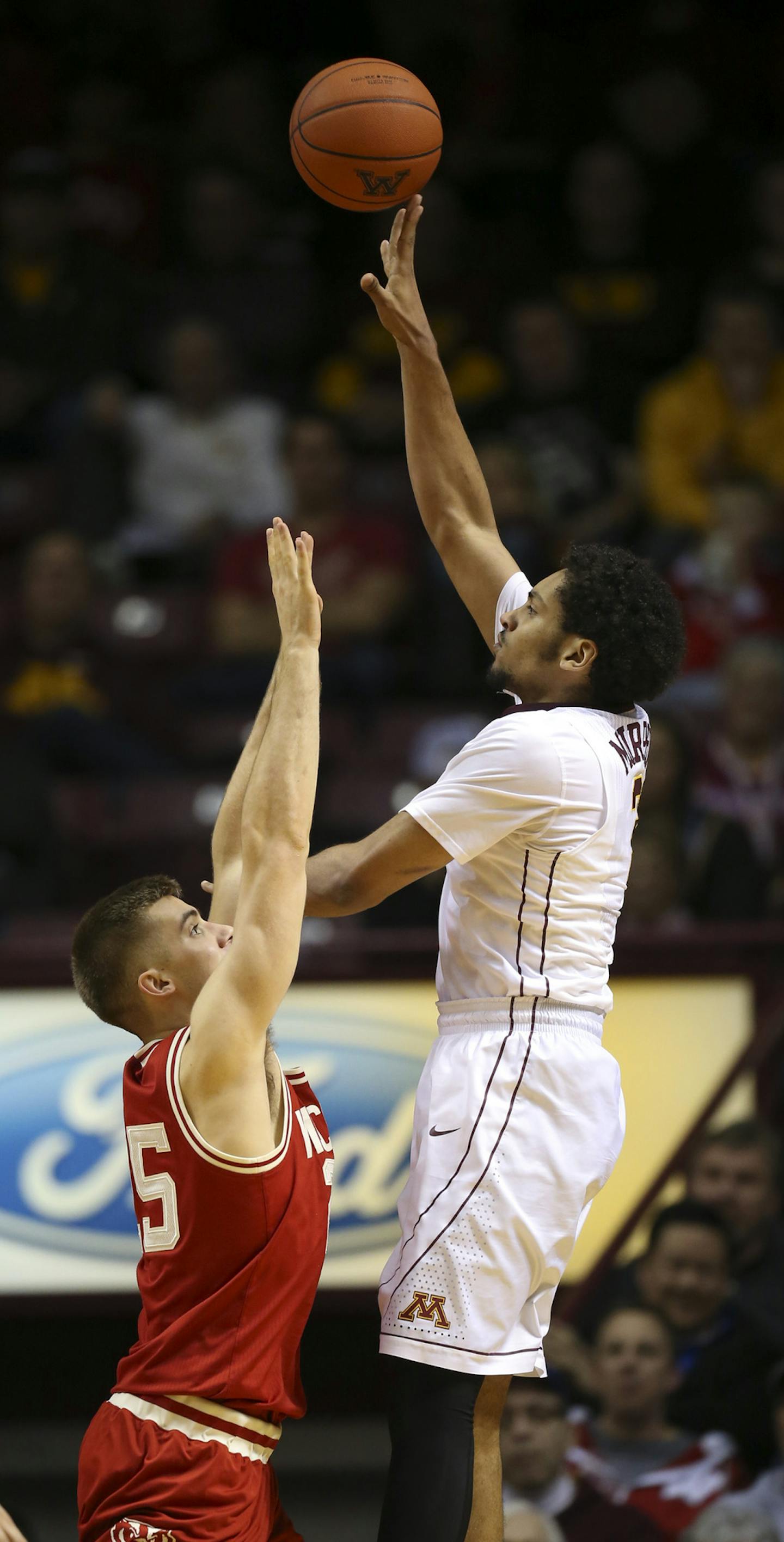 Gophers forward Jordan Murphy (3) let a second half shot fly over Badgers forward Alex Illikainen (25) Wednesday night. He finished with 15 points for the night. ] JEFF WHEELER &#xef; jeff.wheeler@startribune.com The University of Minnesota men's basketball team lost 62-49 to Wisconsin Wednesday night, March 2, 2016 in their last game of the season at Williams Arena in Minneapolis.