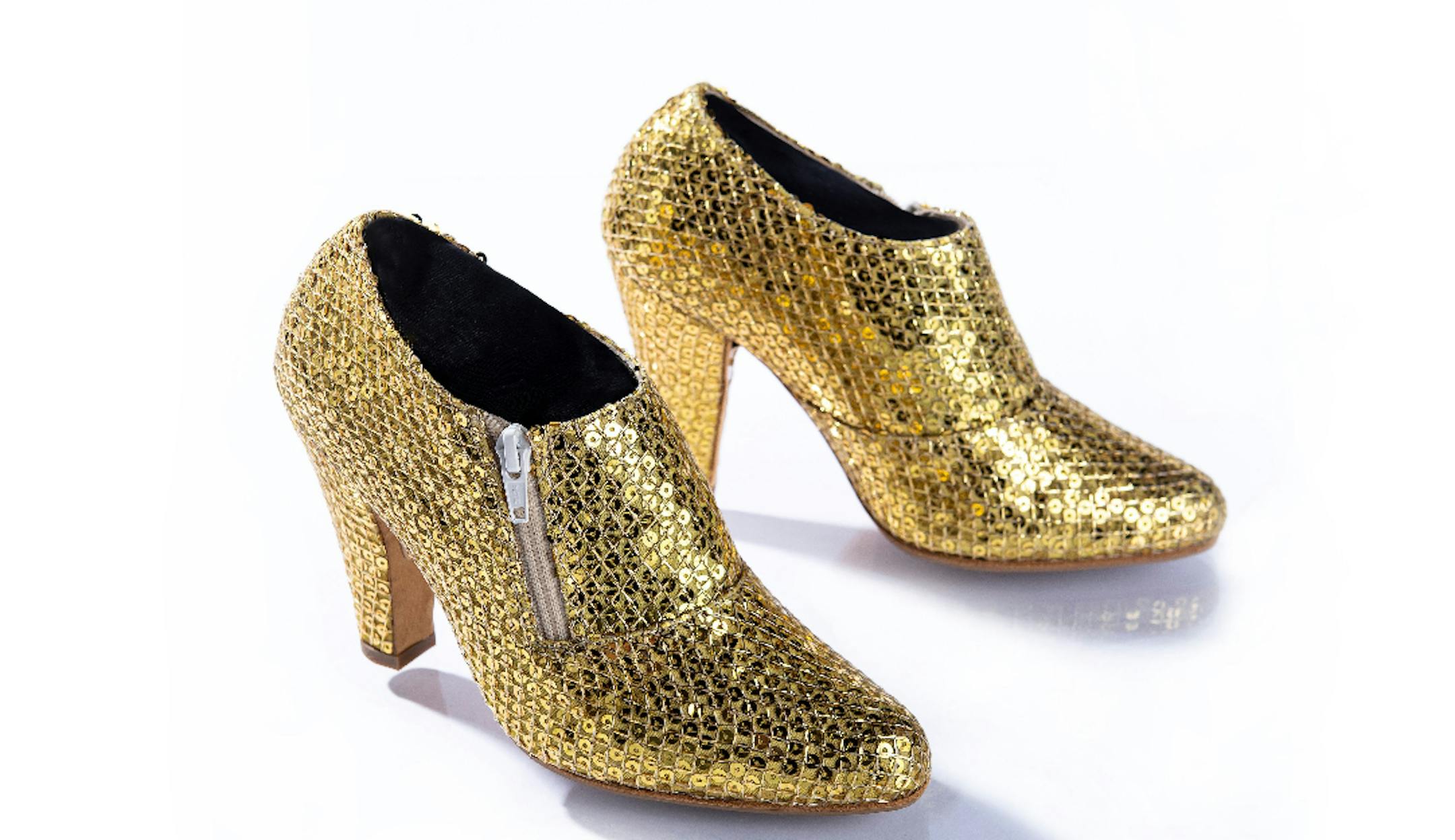 Prince wore these gold metallic shoes during his 2010-2011 Welcome 2 America Tour. All shows were performed on Prince's iconic Love Symbol stage and featured appearances by several guest stars, including Janelle Monae, Alicia Keys, and Questlove, among others. The production toured throughout the United States before proceeding internationally, where each leg was marked by the "Welcome 2" moniker, followed by the continent.