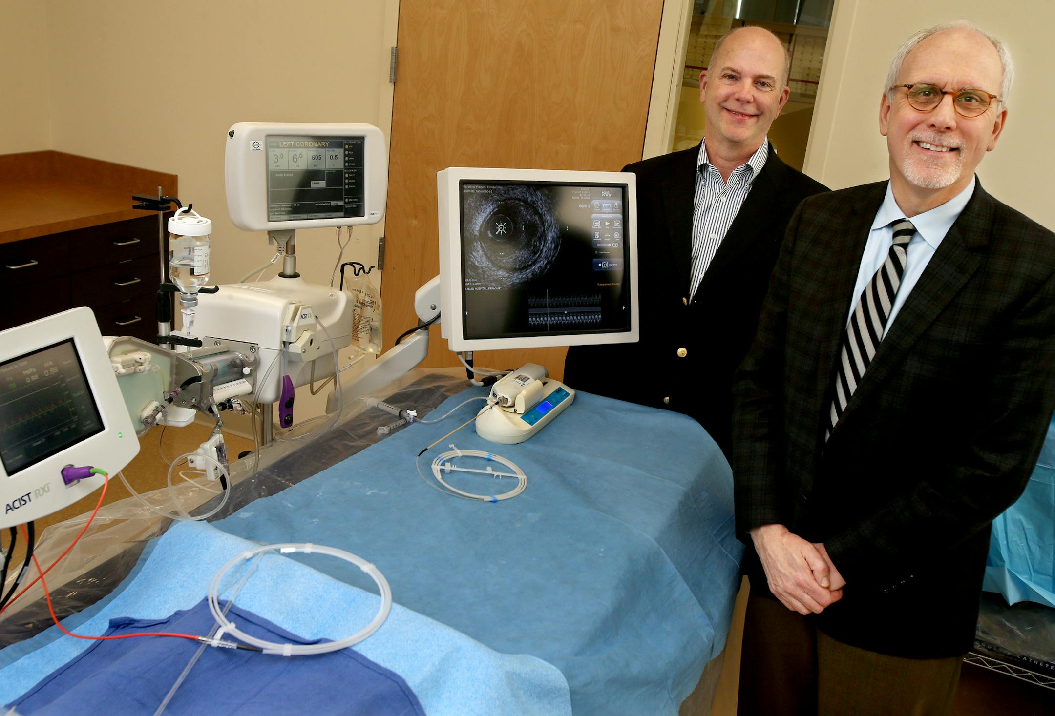 Medical technology companies Acist and HLT share the same founder and chief scientific officer, Dr. Robert Wilson, left, and president and chief operating officer, Tom Morizio.