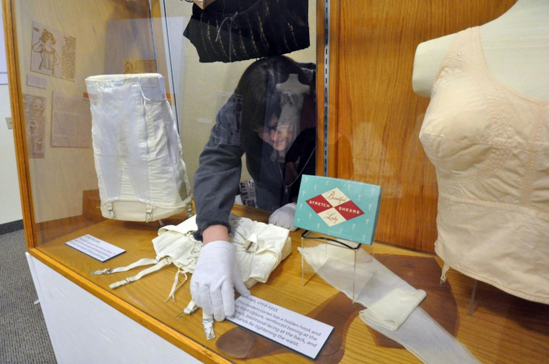 Theresa Norman, curator of exhibits and collections at the Stans Museum in Shakopee, set up the new exhibit "Under Where? Unmentionables Exposed."