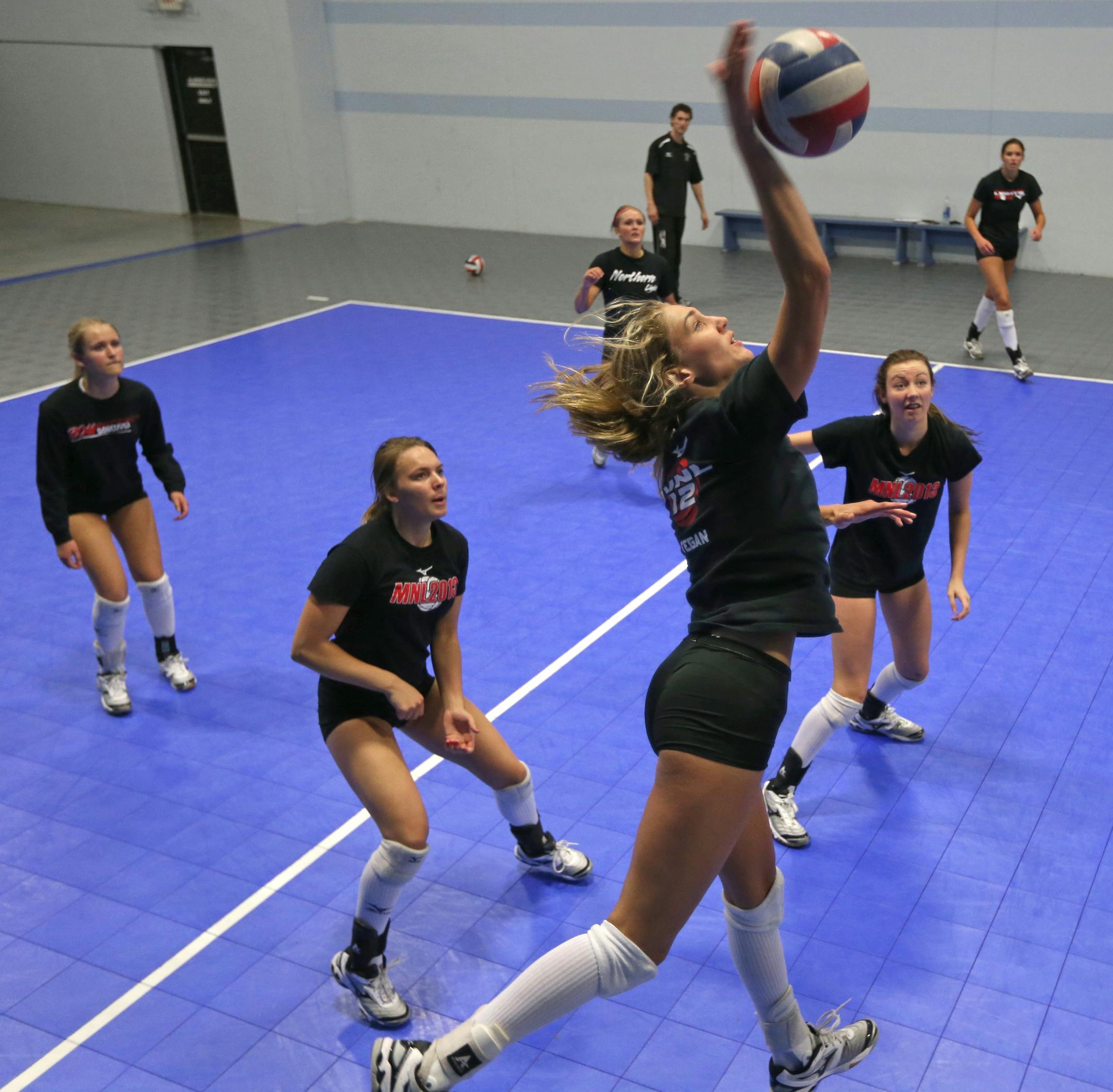 (right) Tegan LaBerge went high to spike the ball as other Northern Lights 18-1 team members got ready for the return volley during practice on 6/19/13. Summer all-zone feature on the Northern Lights volleyball, top team of elite high school players. PThe team will lleave later in the week for a big tournament. Jim Paulsen is the reporter, can provide more details. Story will take up the zone cover in three zones, so looking for main display and secondary shots. The reason they‚Ä