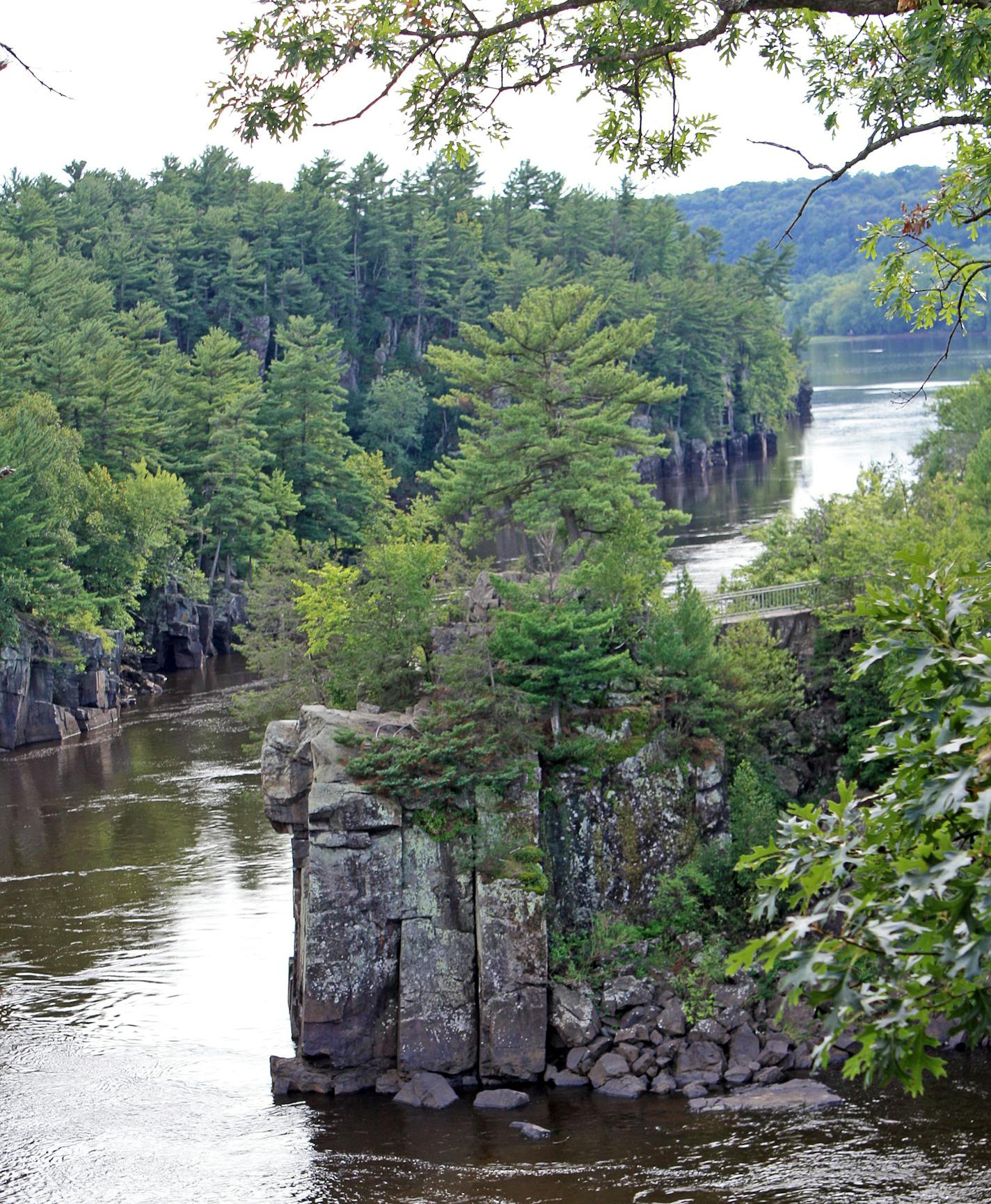 The St. Croix River cuts through a basalt gorge known as the Dalles of the St. Croix in St. Croix Falls. The dramatic rock walls are part of Interstate State Park &#xd1; both on the Wisconsin and Minnesota sides of the river.