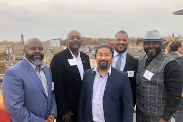 Tri-Construction co-founder Calvin Littlejohn (left) and T.J. Ticey of TRI; Young Moua and Jamil Ford of Mobilize Design & Architecture; and Tri co-fo