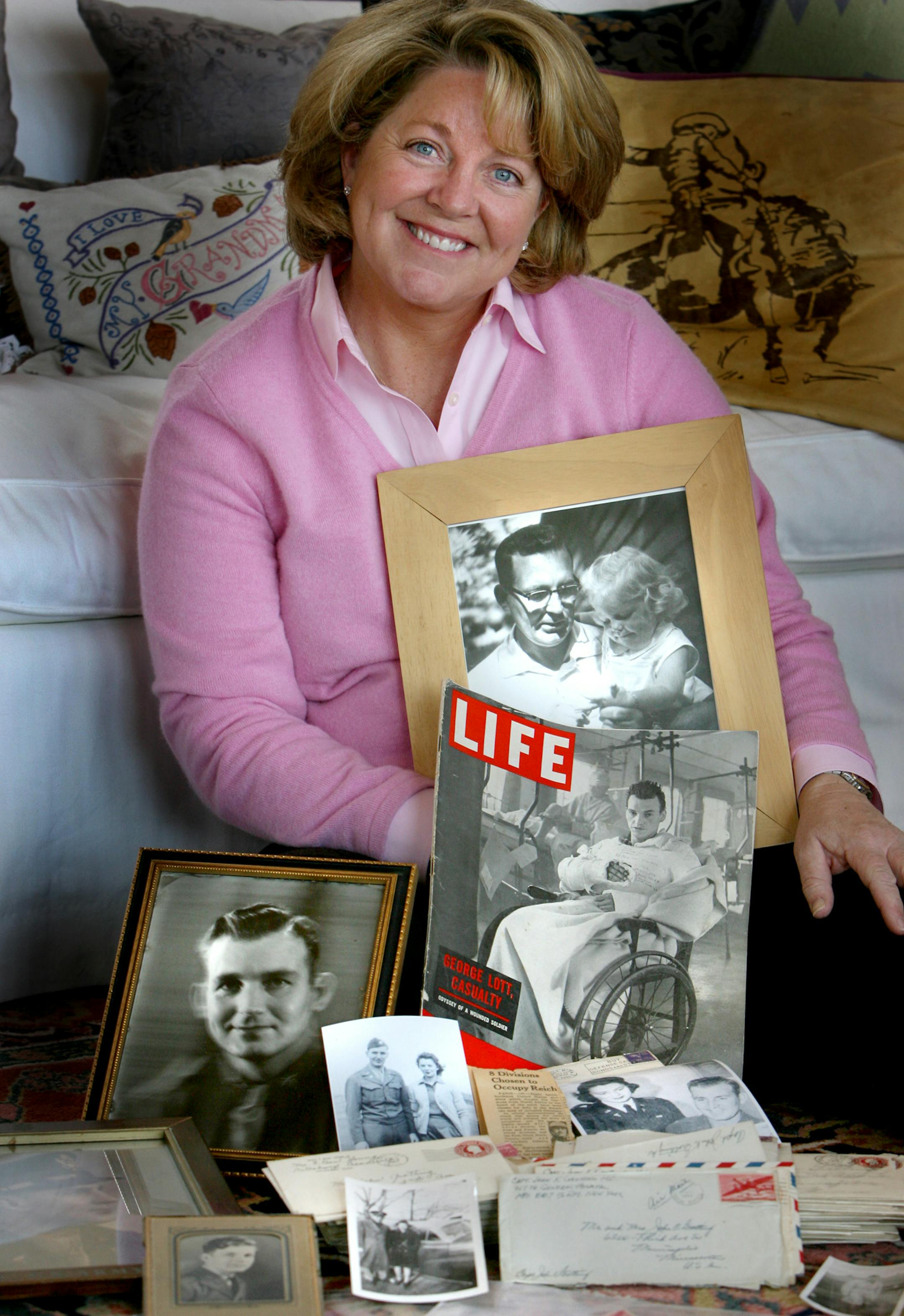 Mary Mithun held a photo of herself and her father. She has spent months tracing the people she met through her father's letters and memorabilia, which she discovered in a box in her aunt's basement.