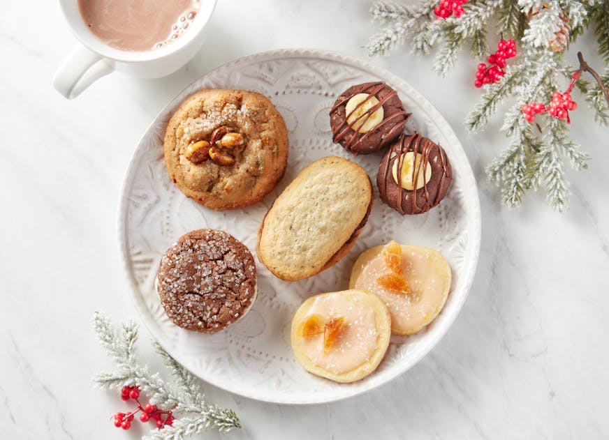 The winning cookies of the 2023 Star Tribune Holiday Cookie Contest. Center, Earl Grey Butter Cookies with Dark Chocolate and Orange Filling (the winner), and finalists: Good Thai Dings, Nanaimo Bar Thumbprint Cookies, Aperol Sparklers and Ginger Chocolate Bliss. Photo: Dennis Becker, Food styling; Lisa Golden Schroeder