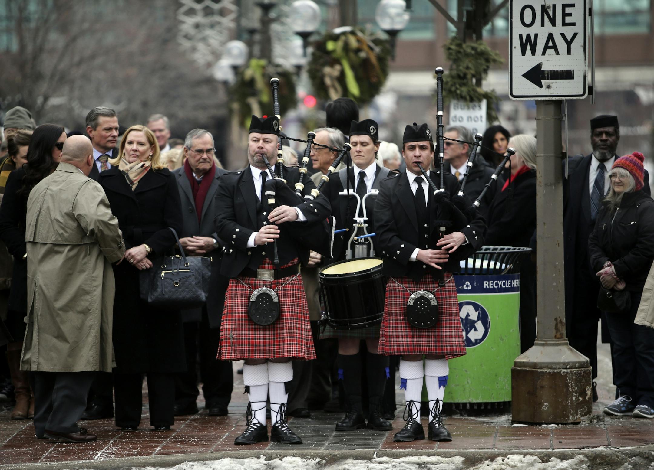 Members of the Macalester College Pipe Band play as mourners wait to follow them on a procession from the church to Orchestra Hall for a reception following services for Joan Adams Mondale at Westminster Presbyterian Church Saturday, Feb. 8, 2014, in Minneapolis, MN.