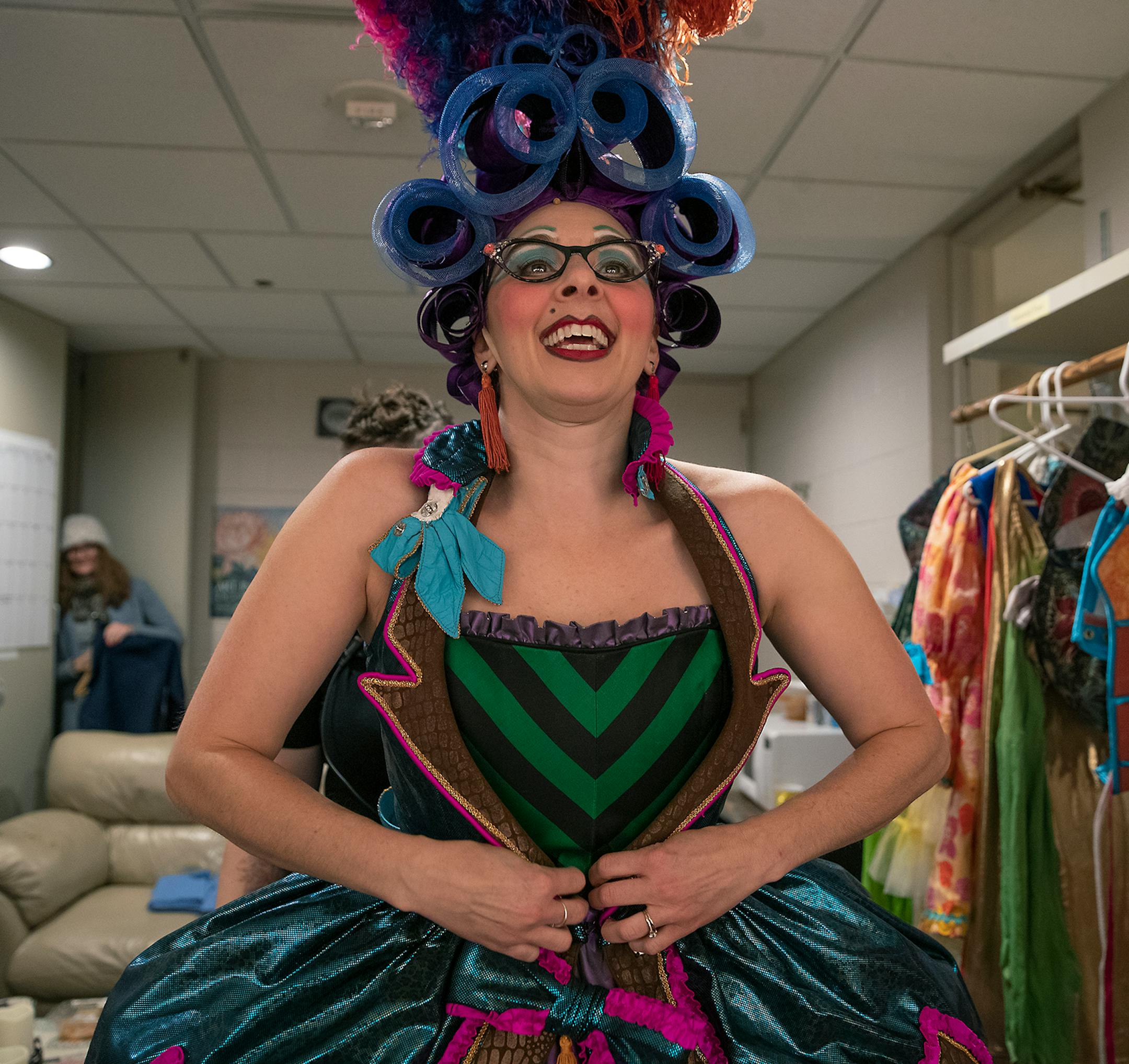 Children's Theatre Company's Andi Soehren tightened a corset onto actor Autumn Ness as they got ready in the dressing room for a dress rehearsal for the Theatre's production of "Cinderella," Friday, November 1, 2019.