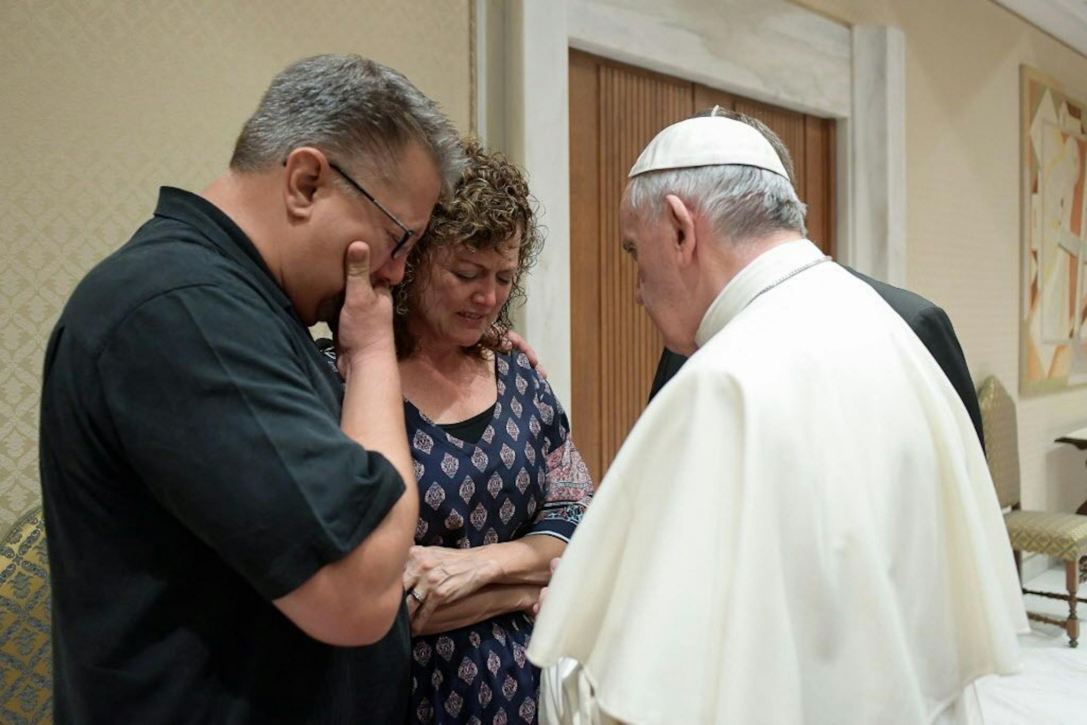 Pope Francis meets Nick, left, and Jodi Solomon, the parents of Beau Solomon, a U.S. college student whose body was found in Rome's Tiber river this week, during private encounter shortly before holding an audience with French pilgrims in a Vatican auditorium, Wednesday, July 6, 2016. Francis expressed to Beau Solomon's parents �feelings of deepest sympathy and compassion, and his closeness in prayer to the Lord for the young man who died so tragically."