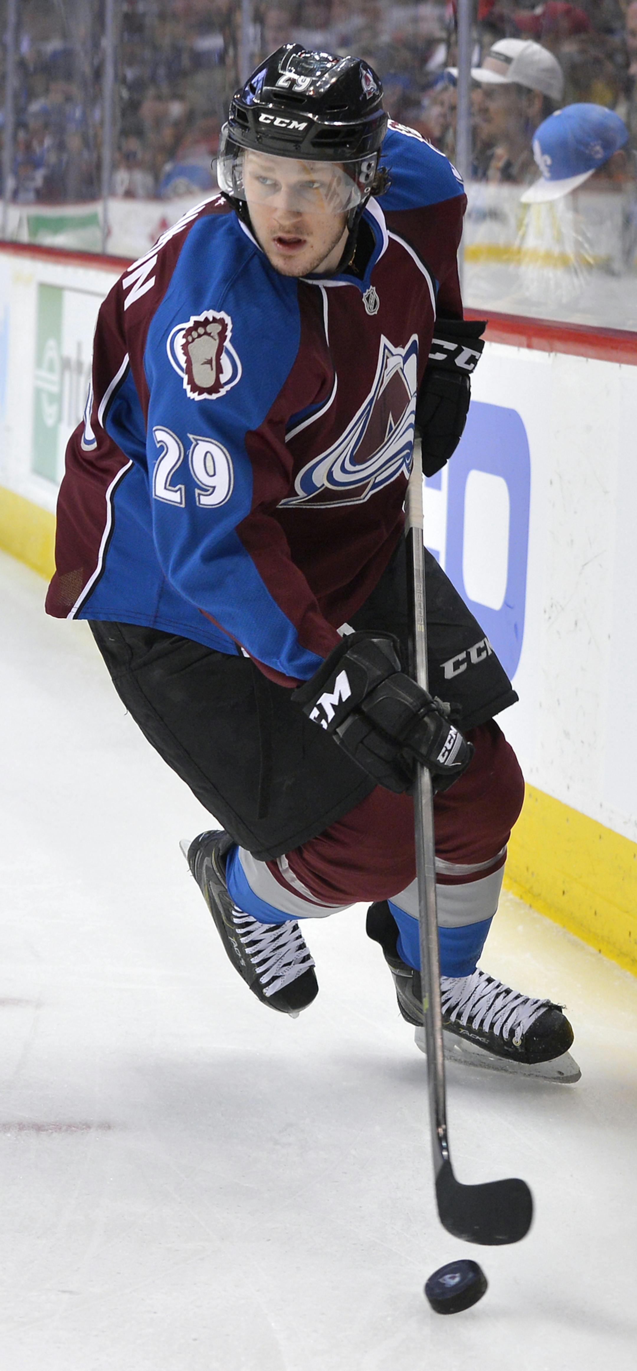 Colorado Avalanche center Nathan MacKinnon skates against the Minnesota Wild during the first period in Game 1 of an NHL hockey first-round playoff series on Thursday, April 17, 2014, in Denver. (AP Photo/Jack Dempsey) ORG XMIT: otk