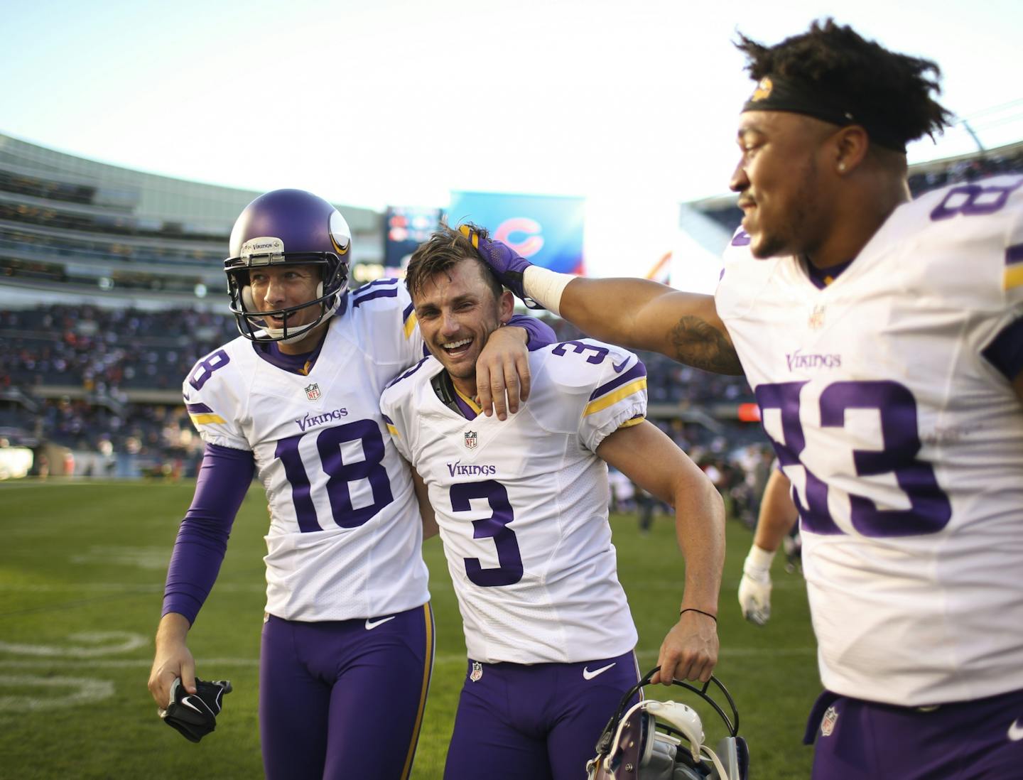 Vikings kicker Blair Walsh (3) was congratulated by punter Jeff Locke (18) and tight end MyCole Pruitt (83) on his way off the field after hittinga game-winner against the Bears.