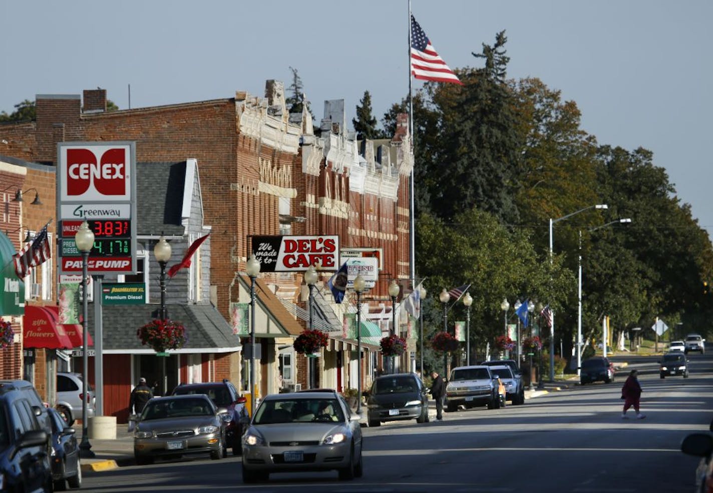 St. Charles, the small Minnesota town that sits half way between Rochester and Winona is at the center of possibly the largest porposed frac sand wash plant and rail-loading facility which will be the gateway to intensive frac sand mining throughout the region. (IN THIS PHOTO) Downtown St. Charles is spruced up with melorial flower baskets and welcome flags hanging from the light posts. Known as the gateway to Whitewater State Park, the quiet bedroom community to Rochester and Winona could see d