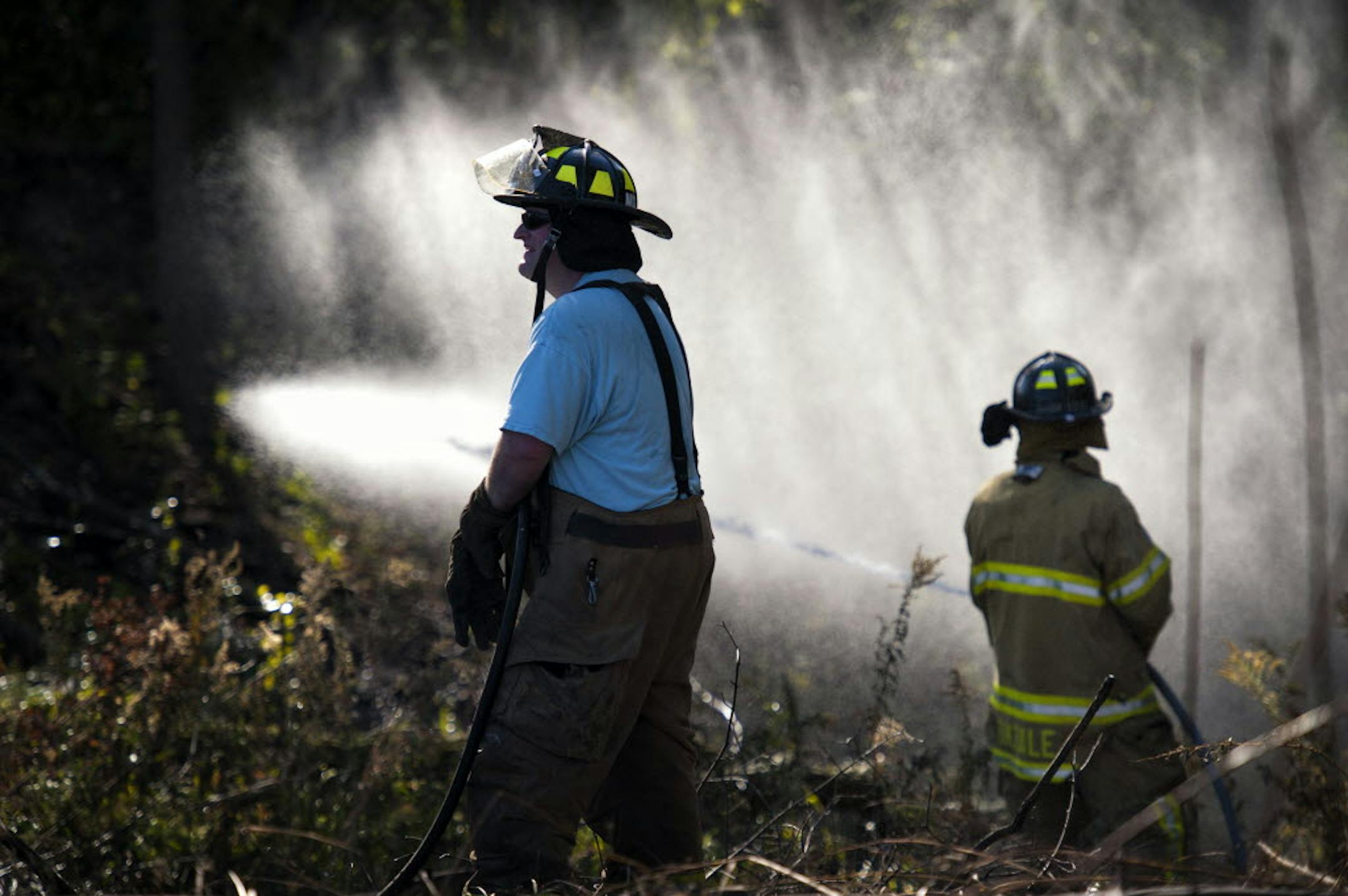 Firefighters from Maplewood, Oakdale and Woodbury responded to a grass and brush fire Monday in southern Maplewood.