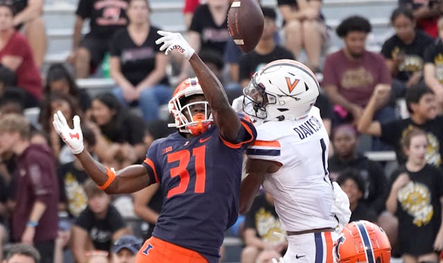 Illinois defensive back Devon Witherspoon breaks up a pass in the end zone intended for Virginia's Lavel Davis Jr., during the second half of an NCAA 