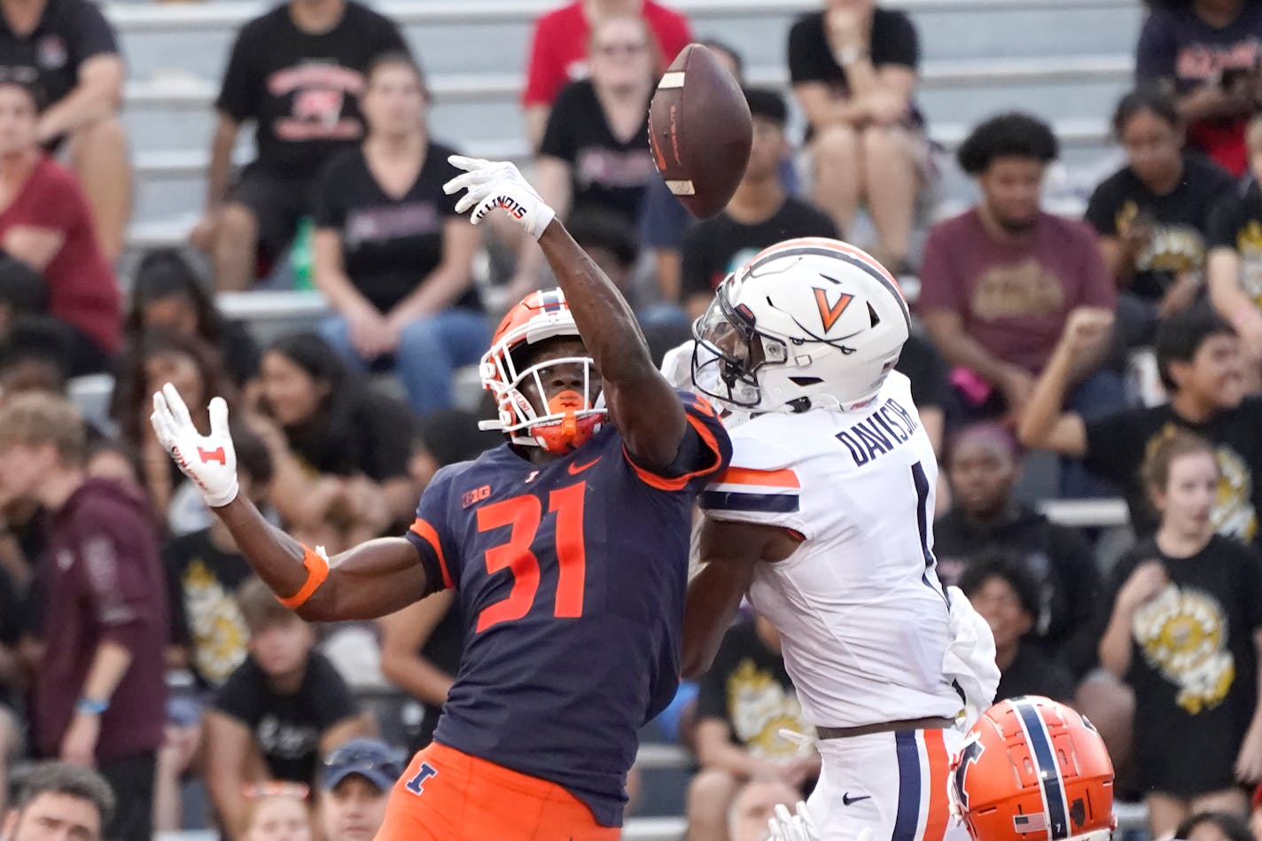 Illinois defensive back Devon Witherspoon breaks up a pass in the end zone intended for Virginia's Lavel Davis Jr., during the second half of an NCAA college football game Saturday, Sept. 10, 2022, in Champaign, Ill. Illinois won 24-3. (AP Photo/Charles Rex Arbogast)