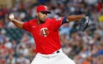 Minnesota Twins relief pitcher Juan Minaya throws to a Baltimore Orioles batter during the eighth inning of a baseball game Friday, July 1, 2022, in M
