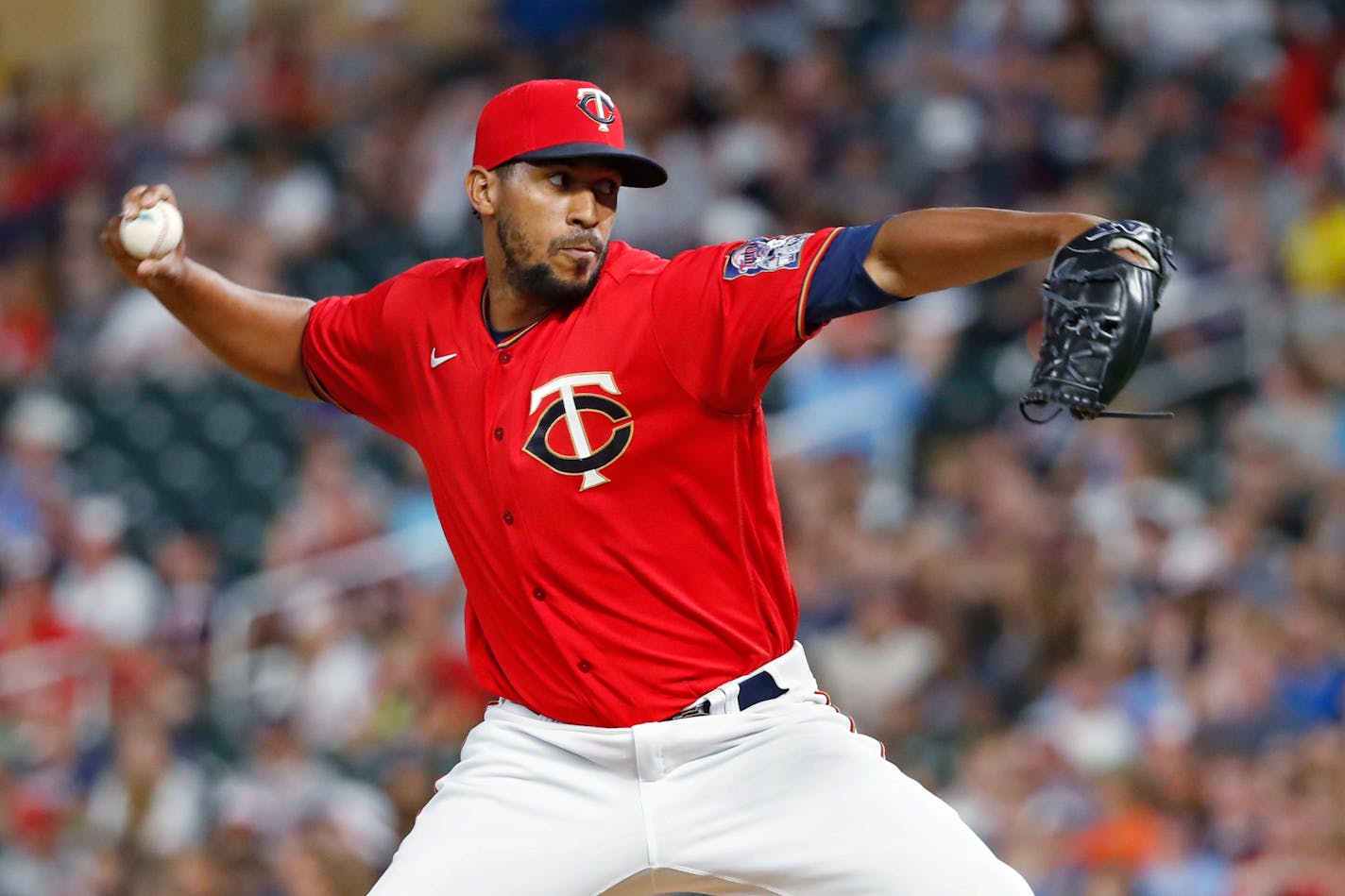 Minnesota Twins relief pitcher Juan Minaya throws to a Baltimore Orioles batter during the eighth inning of a baseball game Friday, July 1, 2022, in Minneapolis. The Twins won 3-2. (AP Photo/Bruce Kluckhohn)