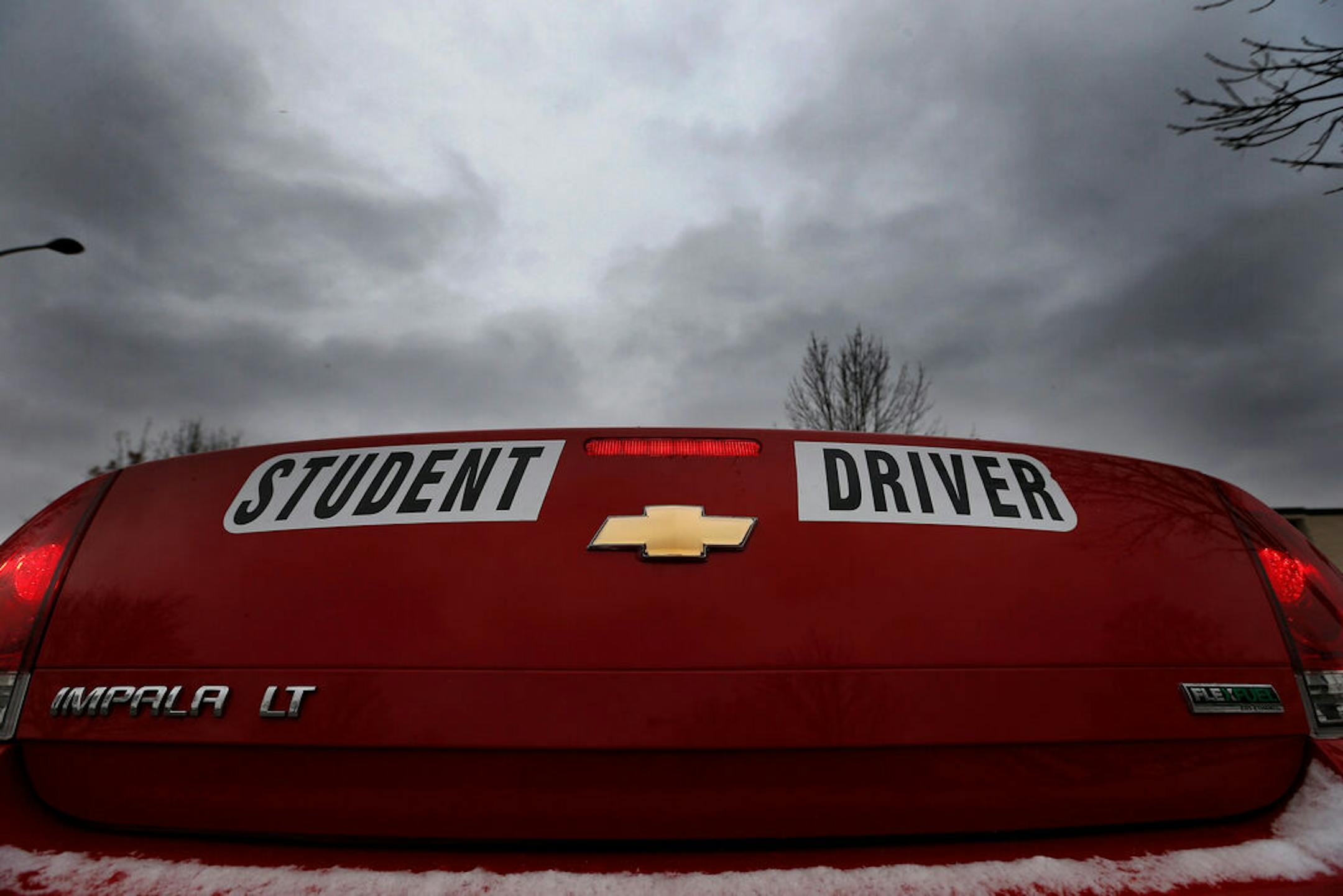 A car marked for student drivers waited to be driven by student driver Soua Xiong, 15, during a lesson with driving instructor John Ertz on Monday afternoon. ] CARLOS GONZALEZ cgonzalez@startribune.com - November 24, 2014, St. Paul, Minn., Highland Park High School, teenage drivers under age 18 will have to spend a minimum of 10 more hours behind the wheel while being supervised by an adult and submit written documentation of those hours under a new law that go into effect on Jan. 1.