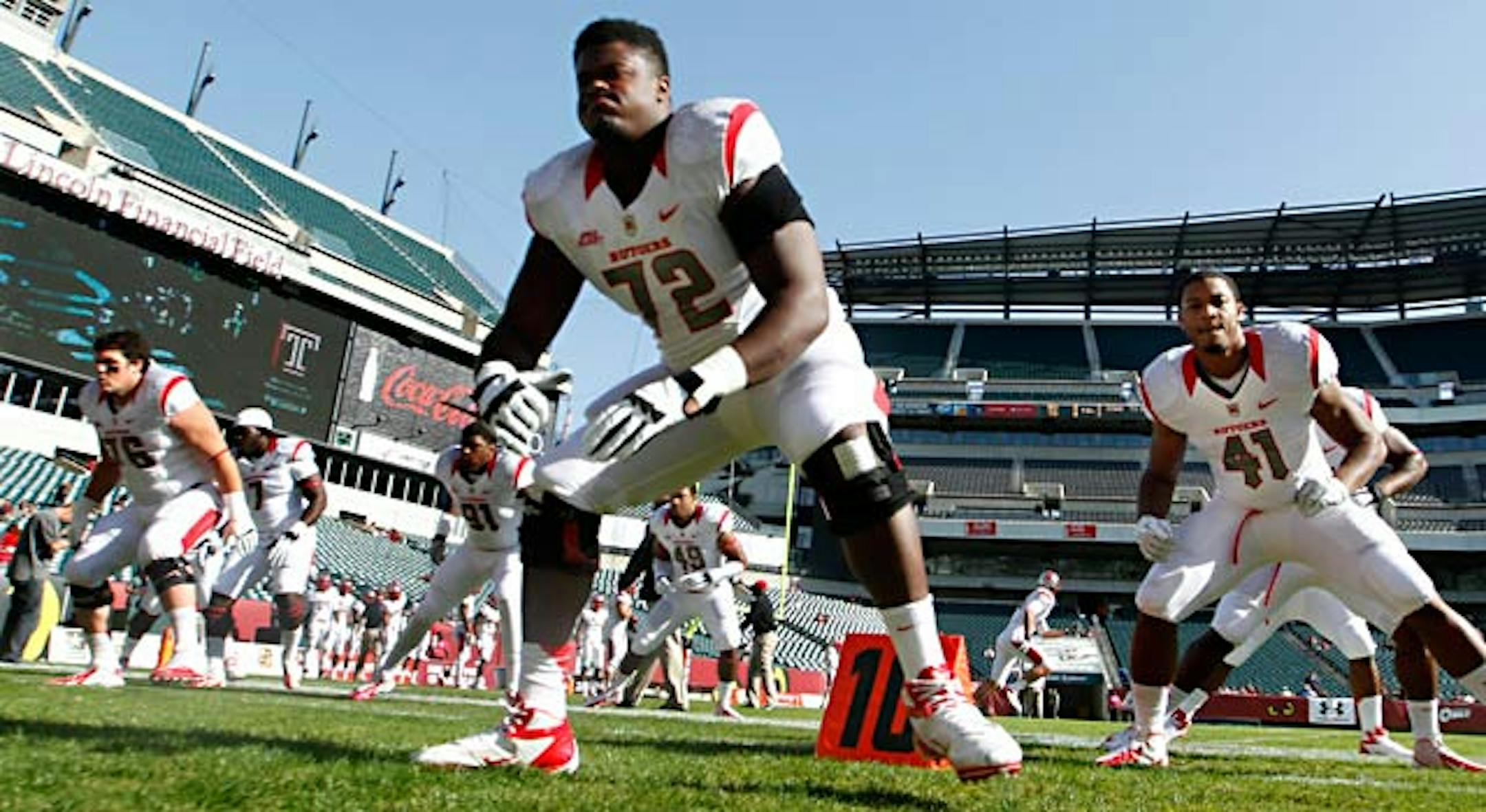 Rutgers players including Kaleb Johnson  (72) and Robert Joseph (41) warm up before an NCAA college football game against Temple Saturday, Oct. 20, 2012, in Philadelphia. (AP Photo/Mel Evans)