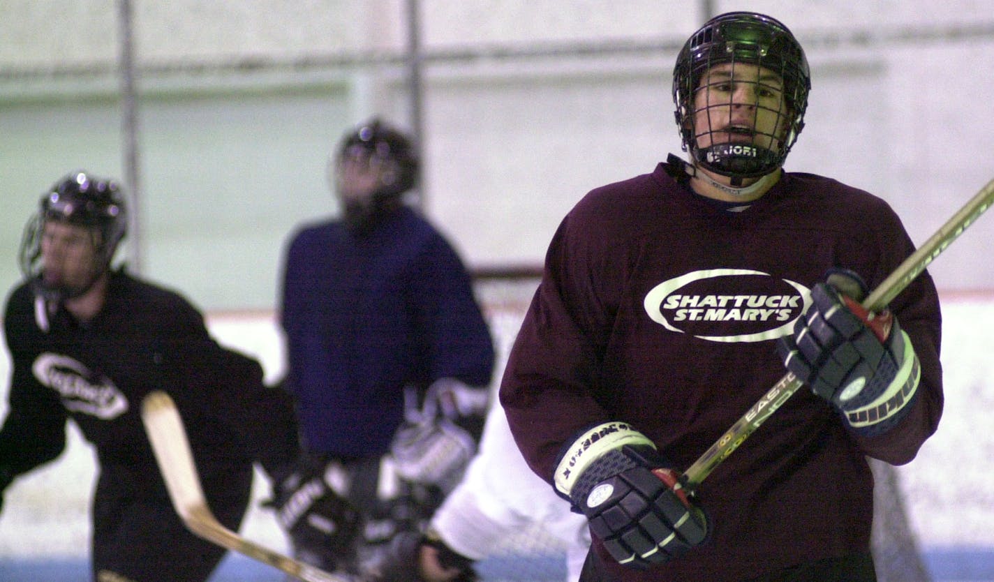 GENERAL INFORMATION: Friday, March 29, 2002-Faribault-Feature story on Zach Parise, a senior at Shattuck St. Mary's considered perhaps the best hockey player to ever come out of Minnesota IN THIS PHOTO: Taking a deep breath Zach Parise heads to the bench after his shift was over near the end of hockey practice at Shattuck St. Mary. ORG XMIT: MIN2014021918481597