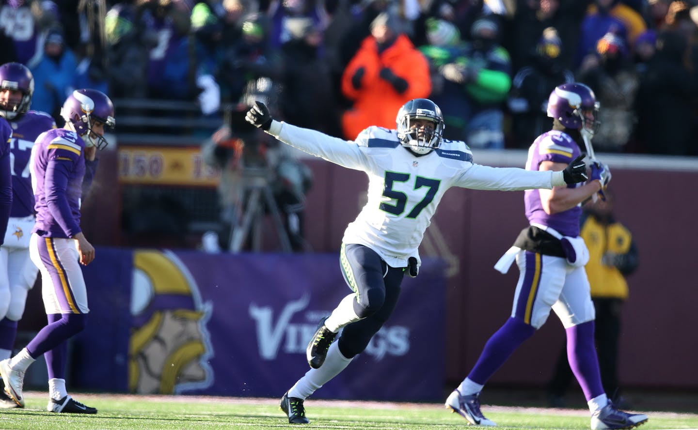 A dejected Minnesota Vikings kicker Blair Walsh (3) walked off the field after missing a 27-yard field goal as Seattle Seahawks outside linebacker Mike Morgan (57) celebrated