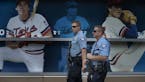 Minneapolis Police officers A. Allen left, and S.J Laux and SWAT team members stood outside Target Field after the Twins game as a reaction to the mas