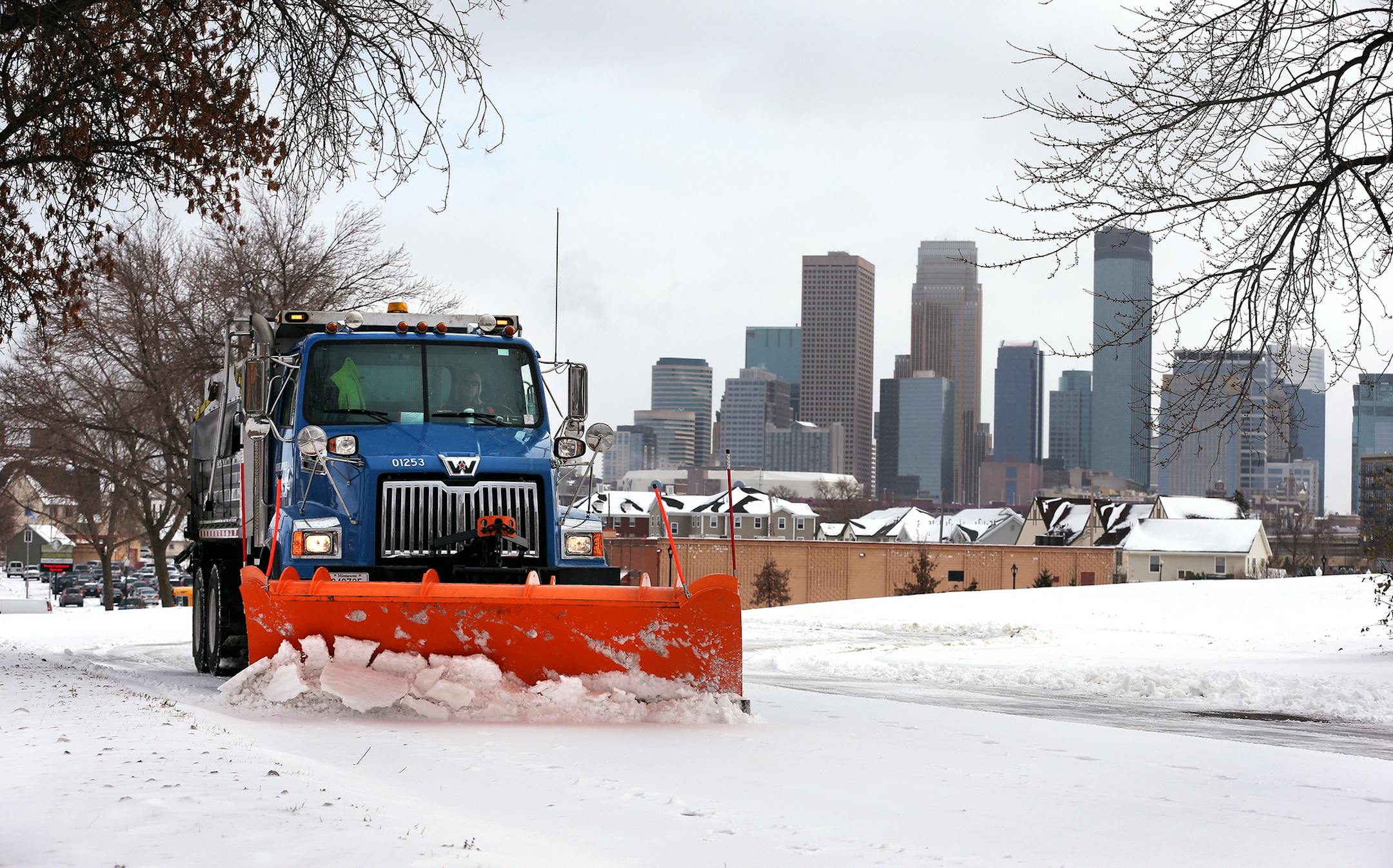 City of Minneapolis truck driver Vicky Stich plows snow and lays down sand and salt on Olson Highway Service Road in Minneapolis on Tuesday, November 11, 2014. Stich has been driving a truck for the city for 38 years. ] LEILA NAVIDI leila.navidi@startribune.com /