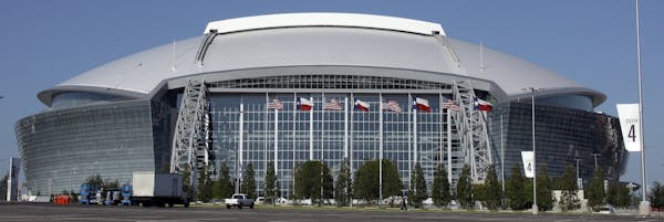 FILE - In this Aug. 19, 2009, file photo, the Dallas Cowboys new football stadium Cowboys Stadium is shown in Arlington, Texas. A person familiar with