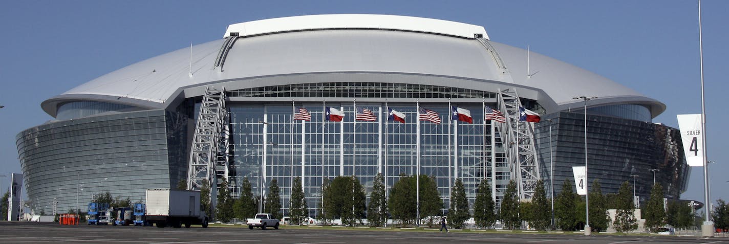 FILE - In this Aug. 19, 2009, file photo, the Dallas Cowboys new football stadium Cowboys Stadium is shown in Arlington, Texas. A person familiar with the decision tells The Associated Press that Arlington, Texas, has beaten out Tampa, Fla., in the bidding to be the site of the first title game in the new playoff system. The game will be Jan. 12, 2015. (AP Photo/Donna McWilliam, File) ORG XMIT: NY167