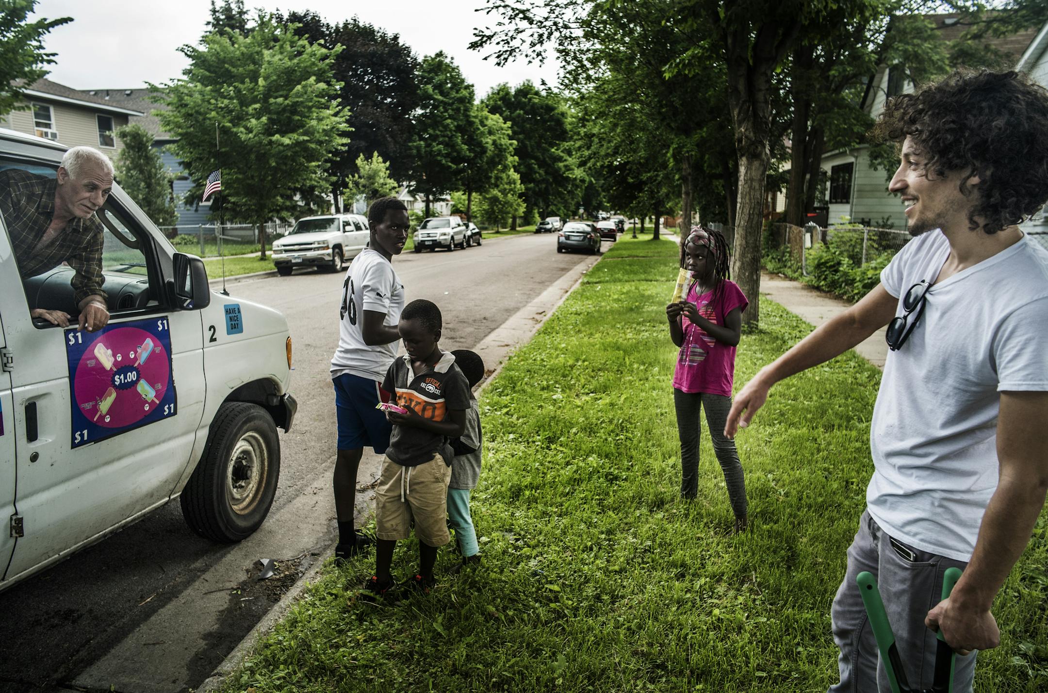 Trucker and triplex owner Moises Romo got some help from the children of his Kenyan tenants while doing yard work. He reward them with some frozen treats from ice cream vendor Dan Assar.]Frogtown, one of St. Paul's traditional entryway neighborhoods to generations of immigrants and blue collar families, is gentrifying, according to an upcoming report by the University of Minnesota's Center for Urban and Regional Affairs.ichard Tsong-Taatariiïrtsong-taatarii@startribune.com