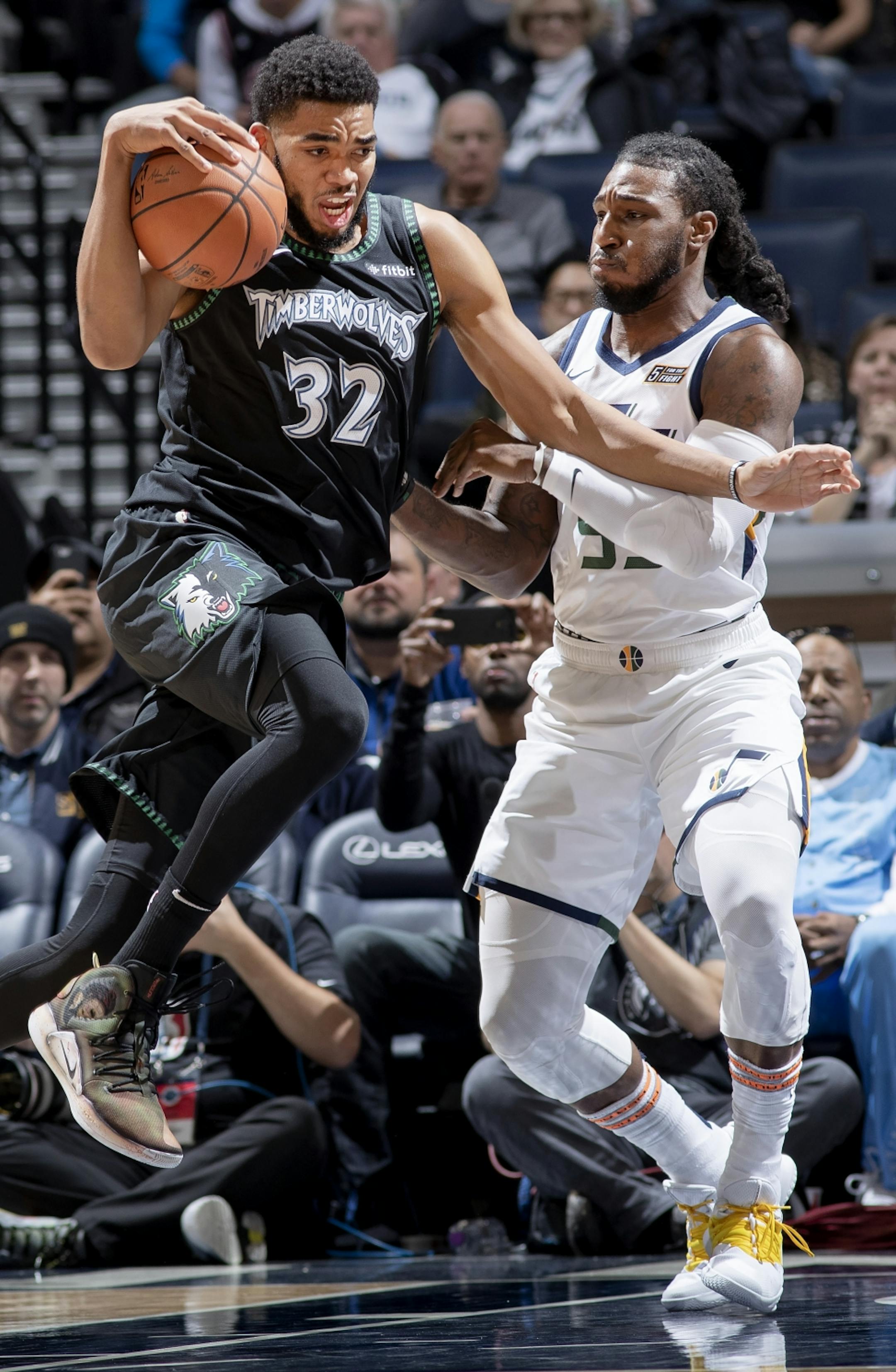 Karl-Anthony Towns (32) was defended by Jae Crowder (99) in the first quarter.