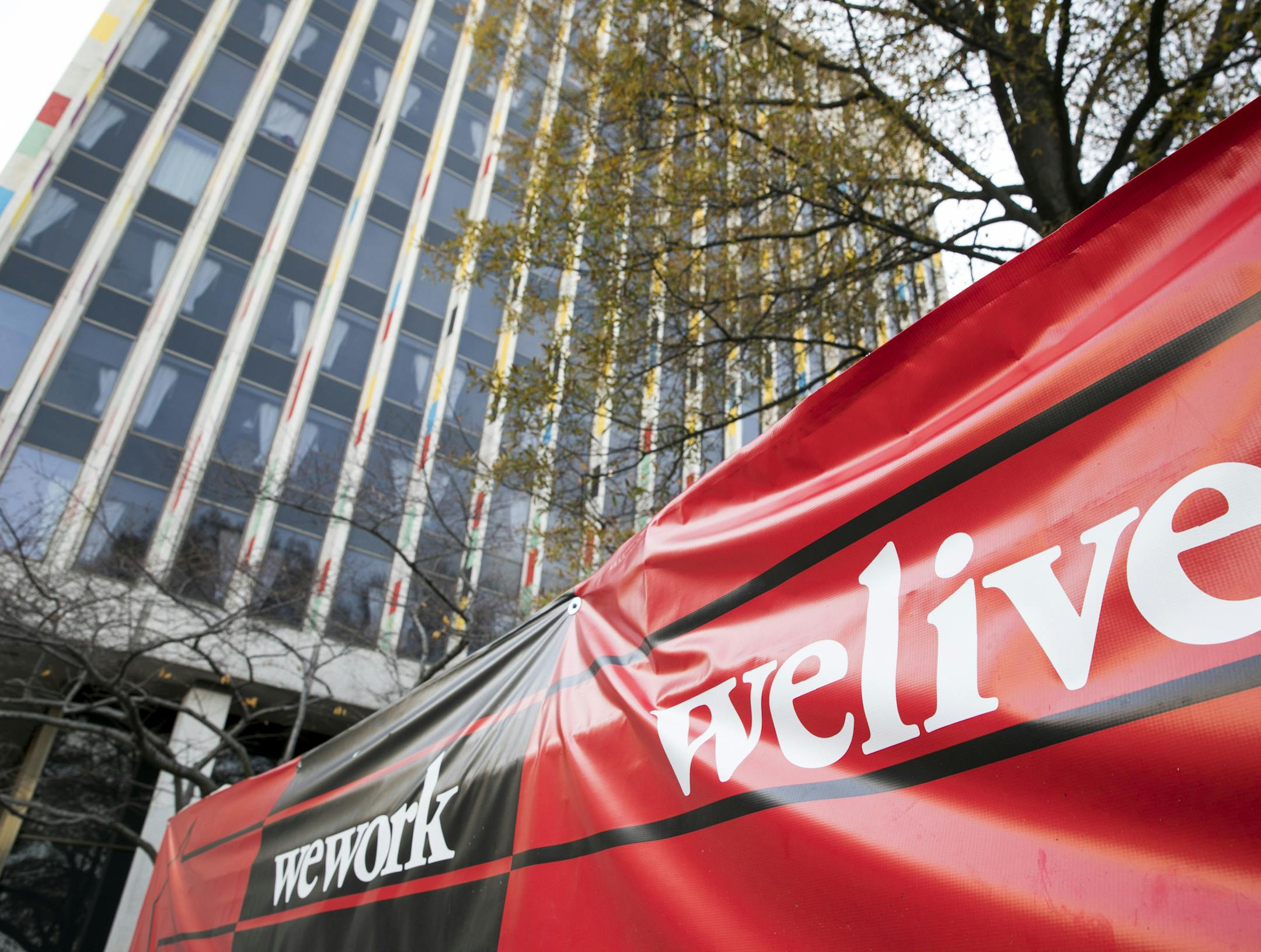A logo sign outside of a WeWork and WeLive location in Arlington, Virginia on November 26, 2017. Photo by Kristoffer Tripplaar(Sipa via AP Images) ORG XMIT: NYWWP