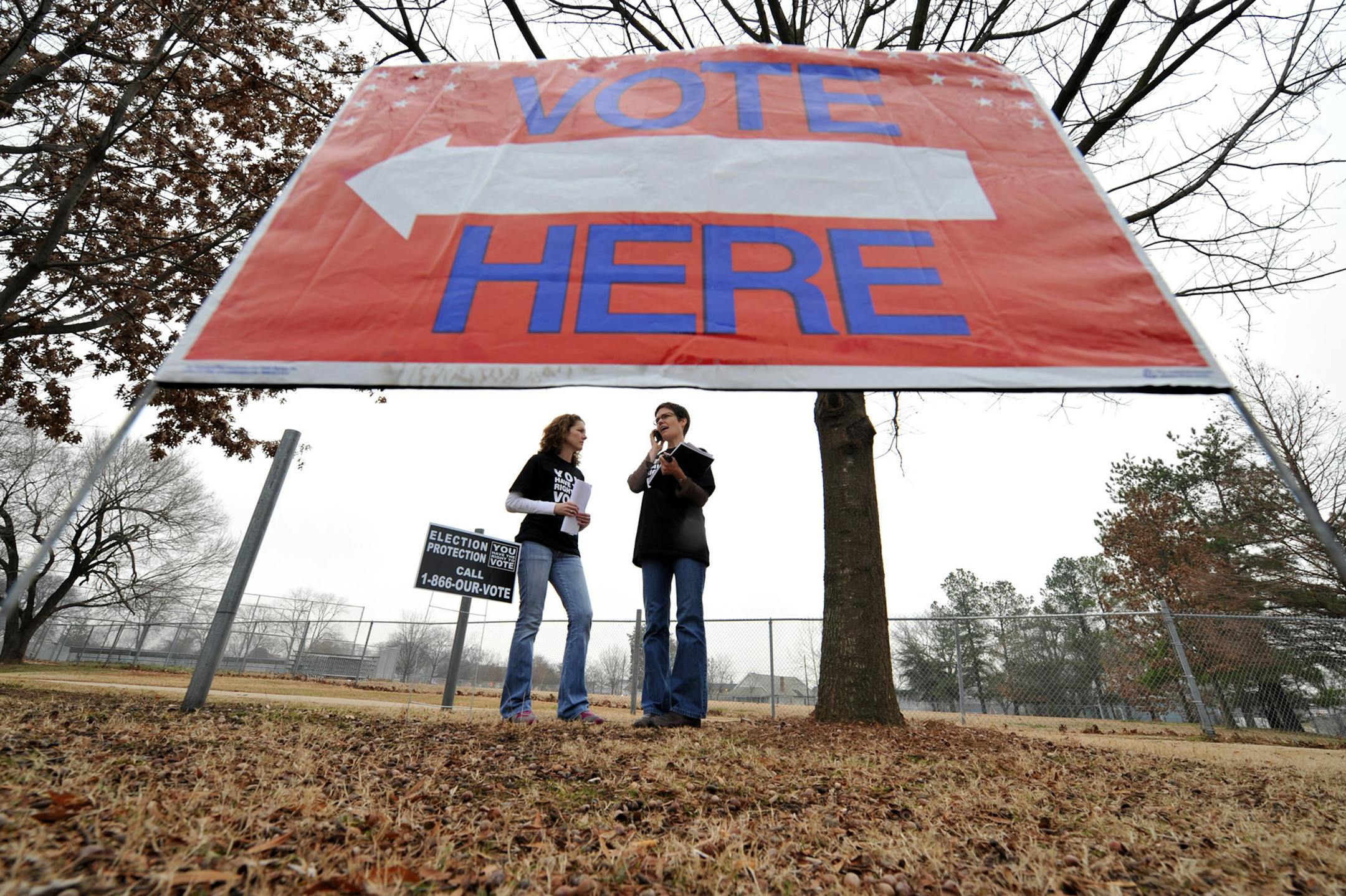 Lawyers Amanda Patterson, left, and Mazie Lynn Causey (CQ), with Election Protection, wait outside a polling place at the MLK Jr., Towers in Atlanta, Georgia, where a voting problem had taken place earlier in the morning, Tuesday, February 5, 2008.
