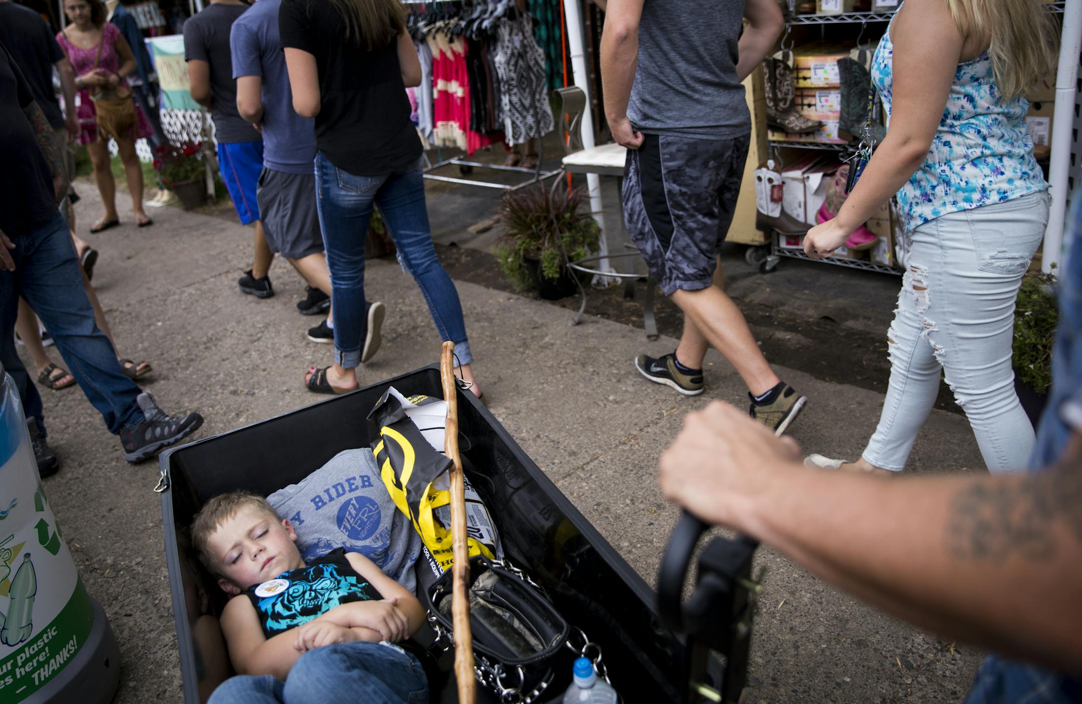 Exavier Voss, 4, of Stacy, fell asleep in a wagon his parents bought on the last day of the State Fair. Did Monday set a record? Find out Tuesday.