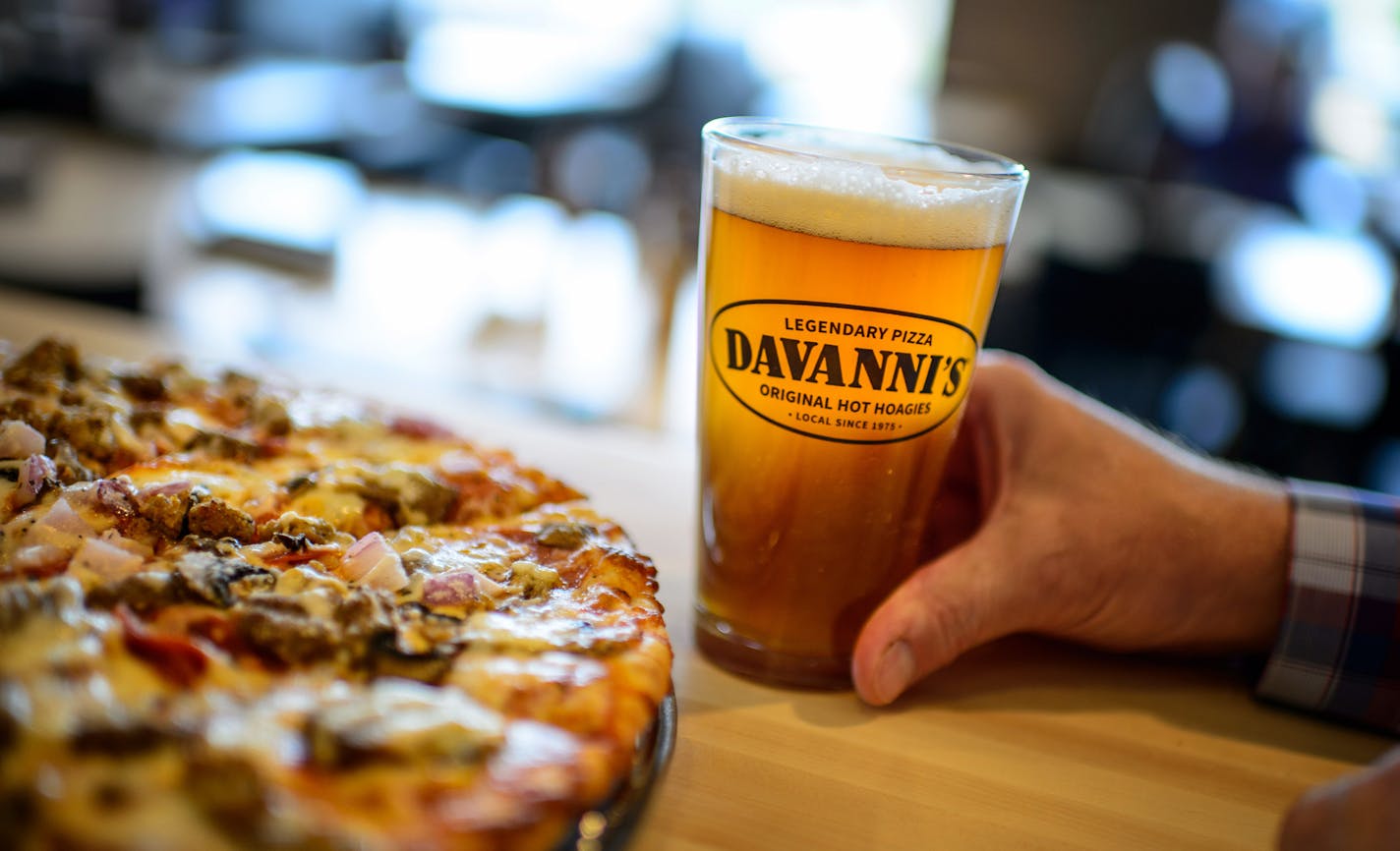 Divanni's president and CFO Bob Stupka sips a craft beer, a new offering.