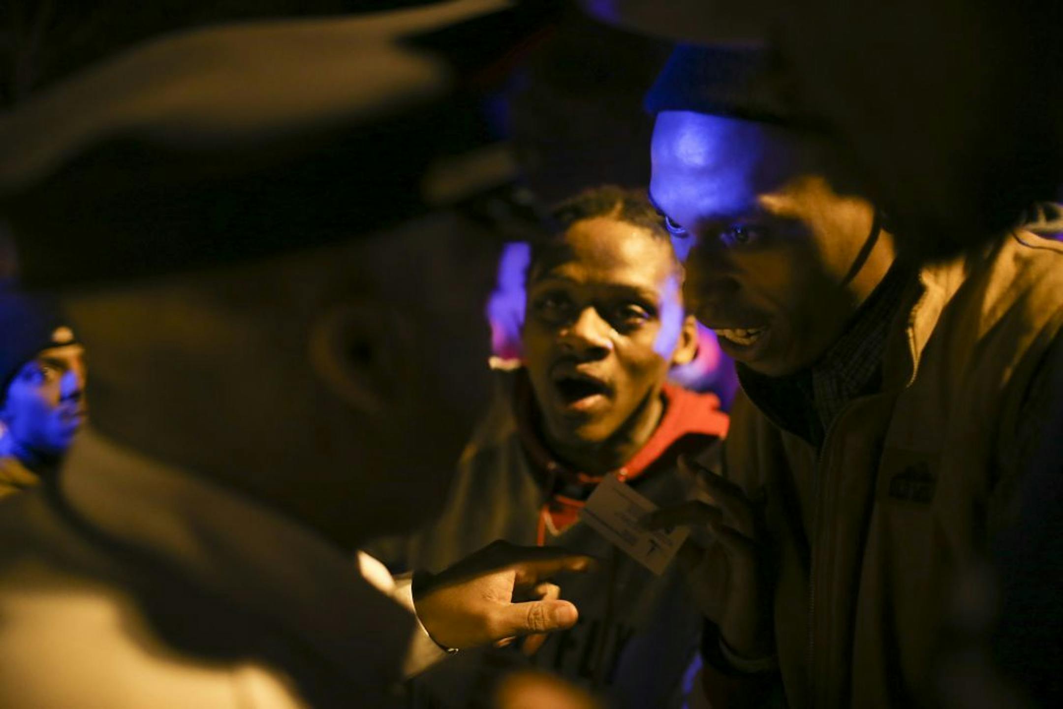 Minneapolis Police Deputy Chief of Staff Medaria Arrdondo, left, spoke with demonstrators on Nov. 15, 2015, during the Fourth Precinct protests that followed the death of Jamar Clark.
