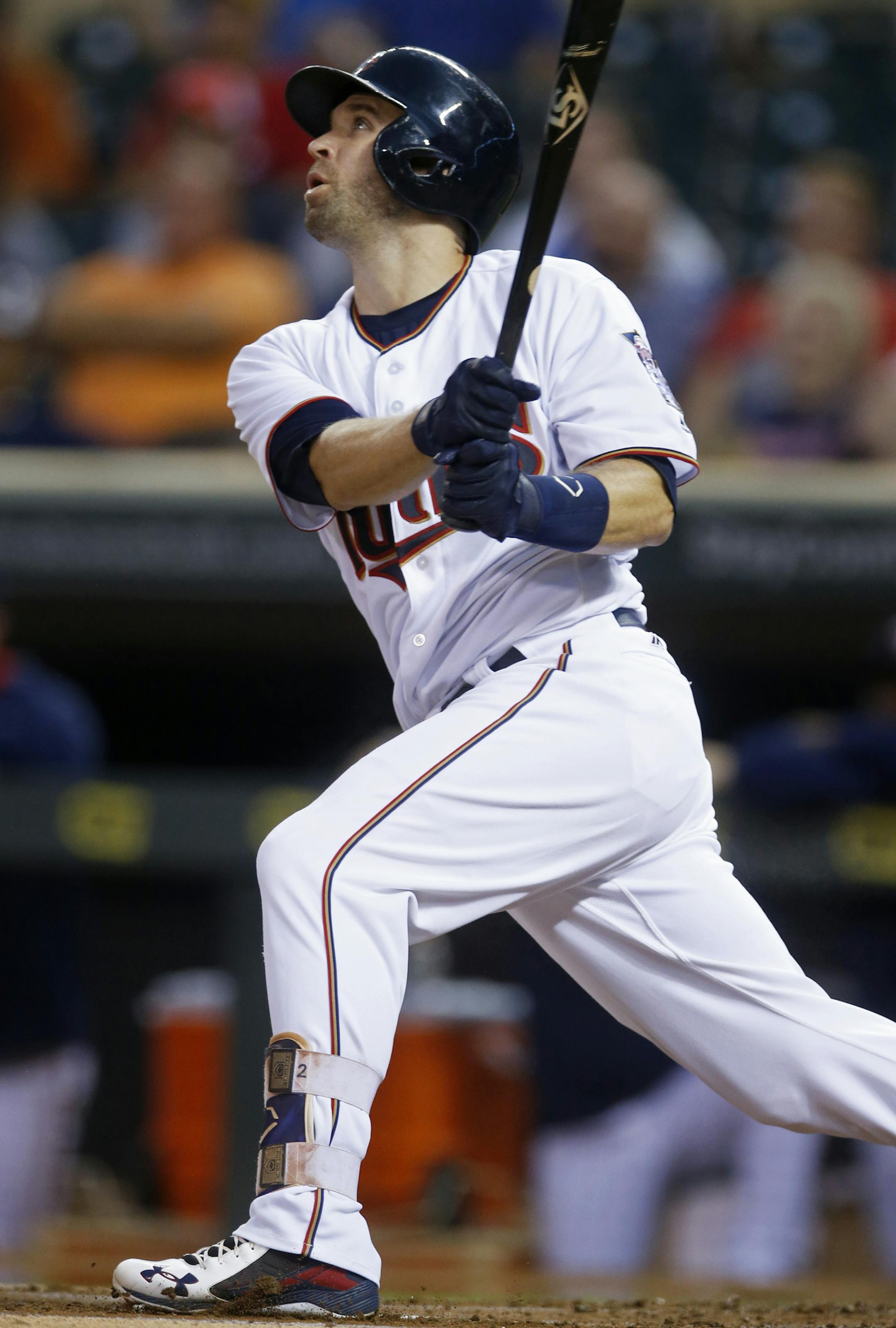 Minnesota Twins’ Brian Dozier watches his leadoff home run off Kansas City Royals pitcher Dillon Gee in the first inning of a baseball game Tuesday, Sept. 6, 2016, in Minneapolis. (AP Photo/Jim Mone)
