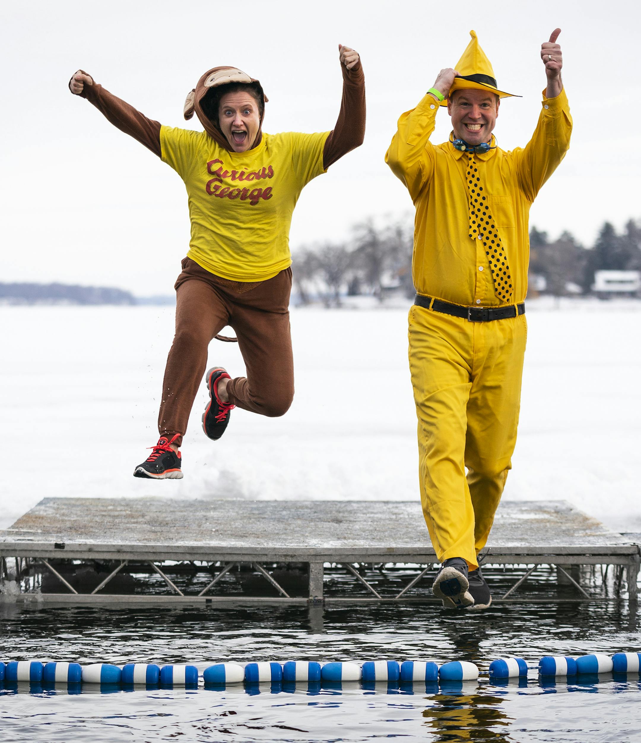 Maureen and Dan Berendes of Blaine dressed as "Curious George" and "The Man with the Yellow Hat" as they participated in the ALARC Ice Dive. ] LEILA NAVIDI • leila.navidi@startribune.com BACKGROUND INFORMATION: Divers participate in the 30th Anniversary ALARC Ice Dive on New Year's Day into Lake Minnetonka in Excelsior on Wednesday, January 1, 2020. ORG XMIT: MIN2001011118323669