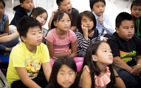 Third-graders at the Community School of Excellence, a St. Paul charter school, listened in Hmong language class.