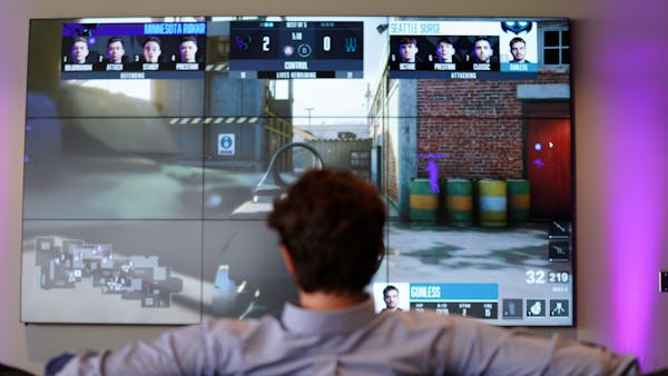 A guests watches a live streamed gaming event at Version1's new headquarters at the Vikings headquarters in Eagan.