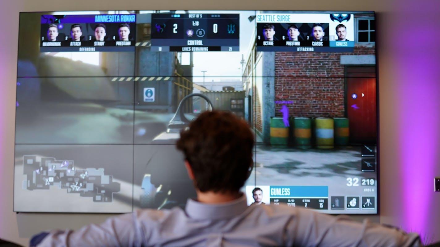 A guests watches a live streamed gaming event at Version1's new headquarters at the Vikings headquarters in Eagan.