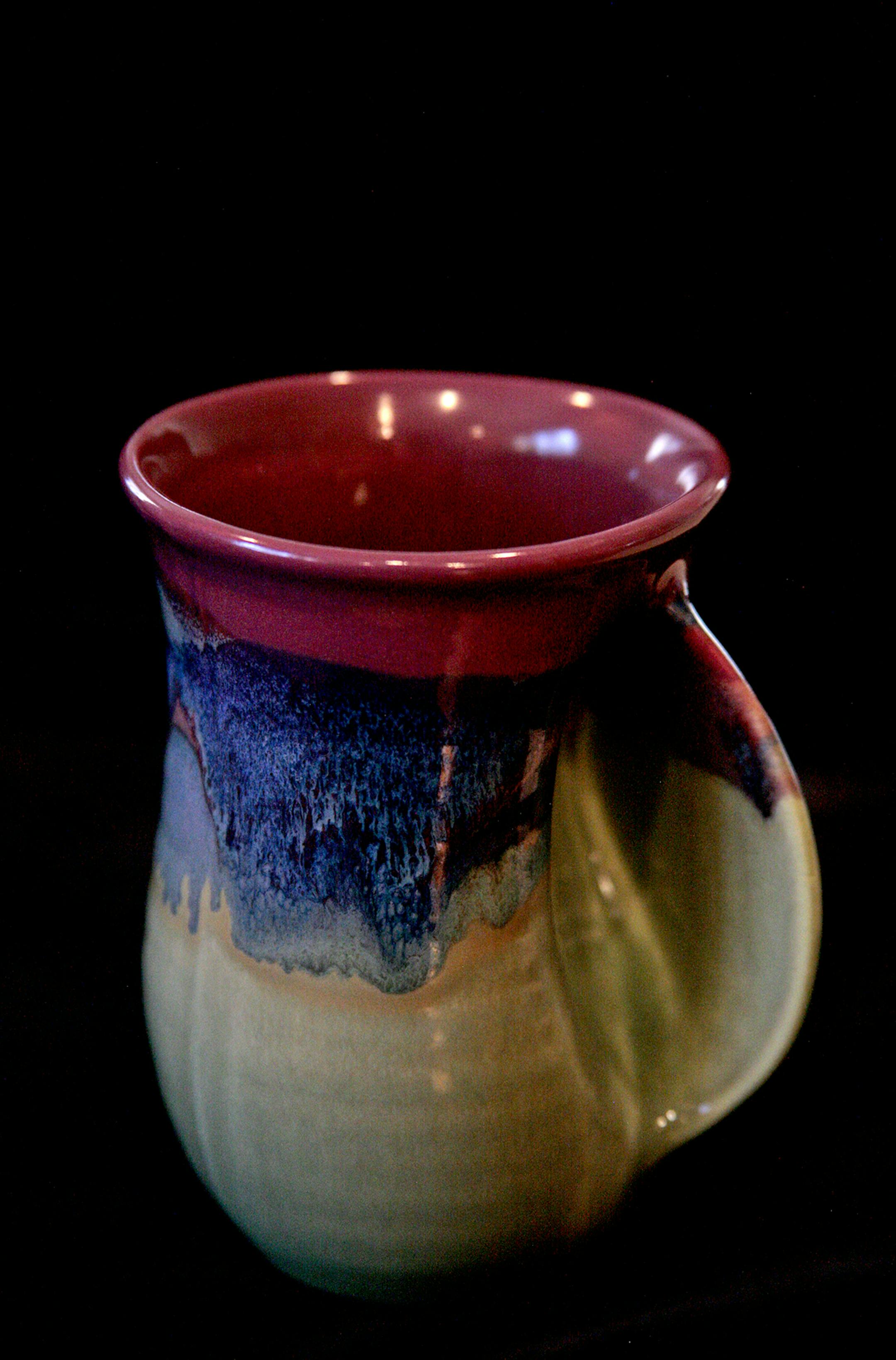 Roger Childers of Minneapolis says his favorite coffee mug is the first thing he reaches for in the morning. "Its unique handle configuration allows me to warm both hands as I plan my attack on the Daily Crossword Puzzle," he says.