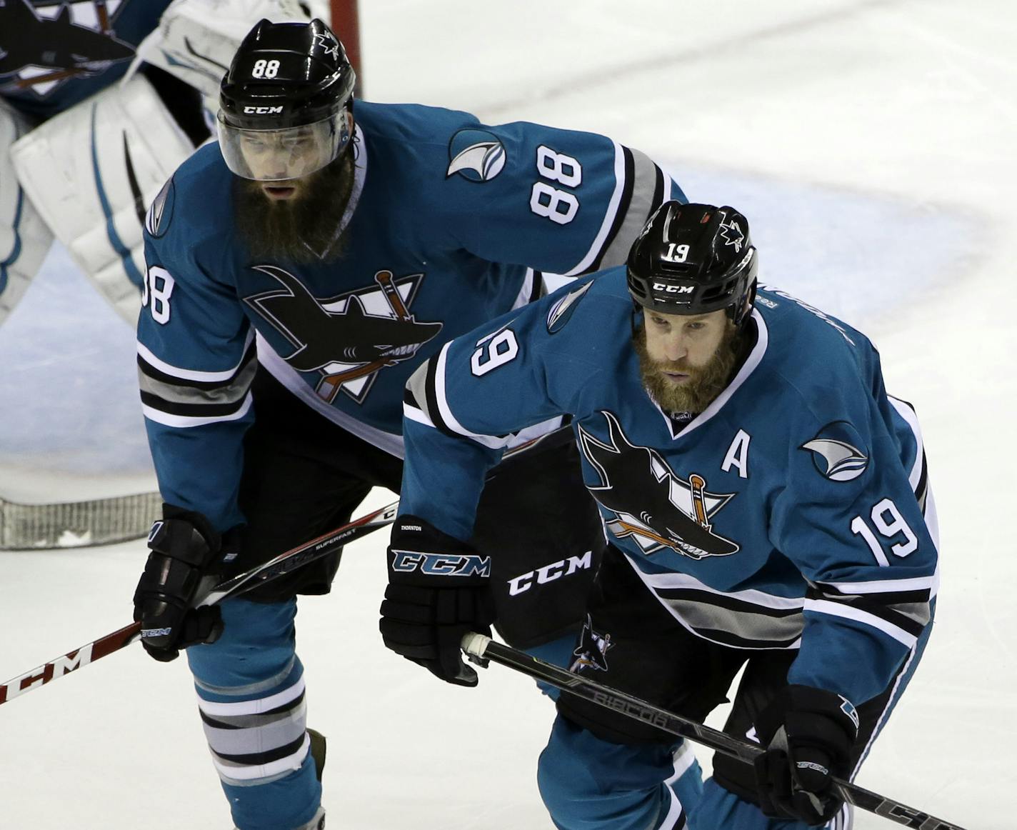 San Jose Sharks' Joe Thornton (19) and Brent Burns (88) during third period of an NHL hockey game against the Ottawa Senators Monday, Jan. 18, 2016, in San Jose, Calif. Ottawa won 4-3 in a shootout. (AP Photo/Marcio Jose Sanchez) ORG XMIT: SJA324