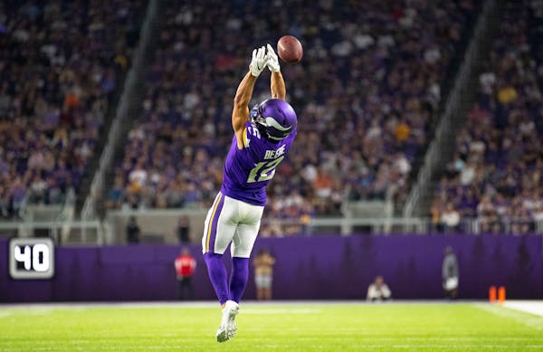 Minnesota Vikings wide receiver Chad Beebe (12) had a pass slip through his hands in the first half. ]