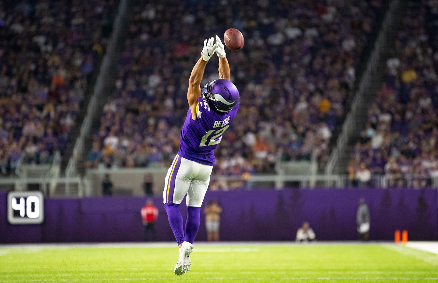 Minnesota Vikings wide receiver Chad Beebe (12) had a pass slip through his hands in the first half. ]