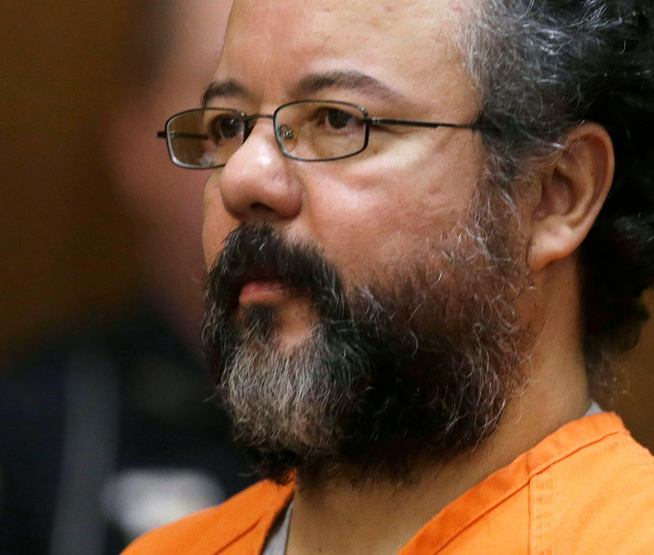 Ariel Castro listens in the courtroom during the sentencing phase Thursday, Aug. 1, 2013, in Cleveland. Three months after an Ohio woman kicked out part of a door to end nearly a decade of captivity, Castro, a onetime school bus driver faces sentencing for kidnapping three women and subjecting them to years of sexual and physical abuse.