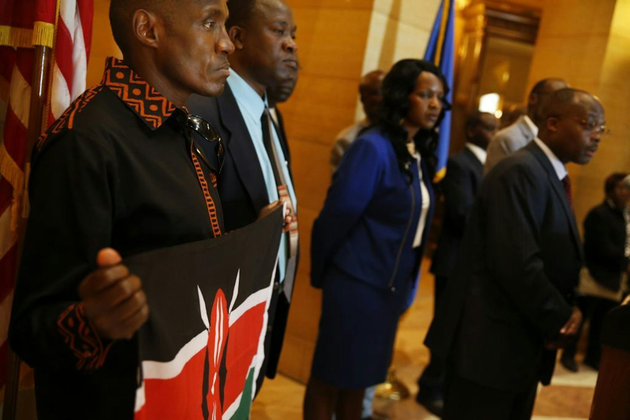 In the rotunda of the state capitol in St. Paul, Kihanya Mwaura held the Kenyan flag in solidarity with other Minnesotan Kenyans who were taking a stand against the attacks by Al Shabab in the shopping mall in Nairobi. Mwaura learned that his cousin's husband was killed in the Westgate mall.